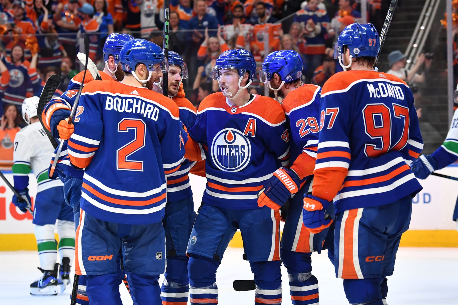 EDMONTON, CANADA - MAY 12: Evan Bouchard #2 of the Edmonton Oilers celebrates his third-period goal against the Vancouver Canucks with his teammates in Game Three of the Second Round of the 2024 Stanley Cup Playoffs at Rogers Place on May 12, 2024, in Edmonton, Alberta, Canada. (Photo by Andy Devlin/NHLI via Getty Images)