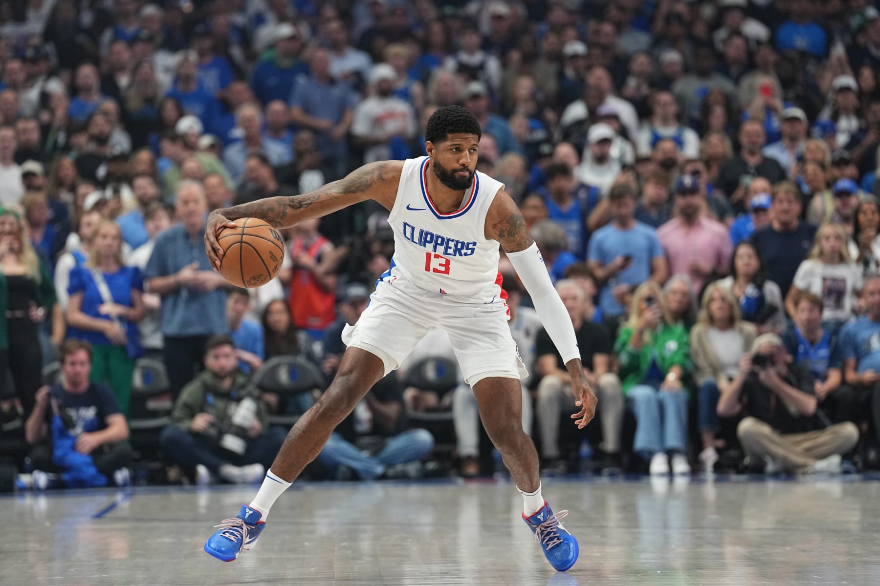 DALLAS, TX - APRIL 28: Paul George #13 of the LA Clippers handles the ball during the game against the Dallas Mavericks during Round 1 Game 4 of the 2024 NBA Playoffs on April 28, 2024 at the American Airlines Center in Dallas, Texas. NOTE TO USER: User expressly acknowledges and agrees that, by downloading and or using this photograph, User is consenting to the terms and conditions of the Getty Images License Agreement. Mandatory Copyright Notice: Copyright 2024 NBAE (Photo by Glenn James/NBAE via Getty Images)