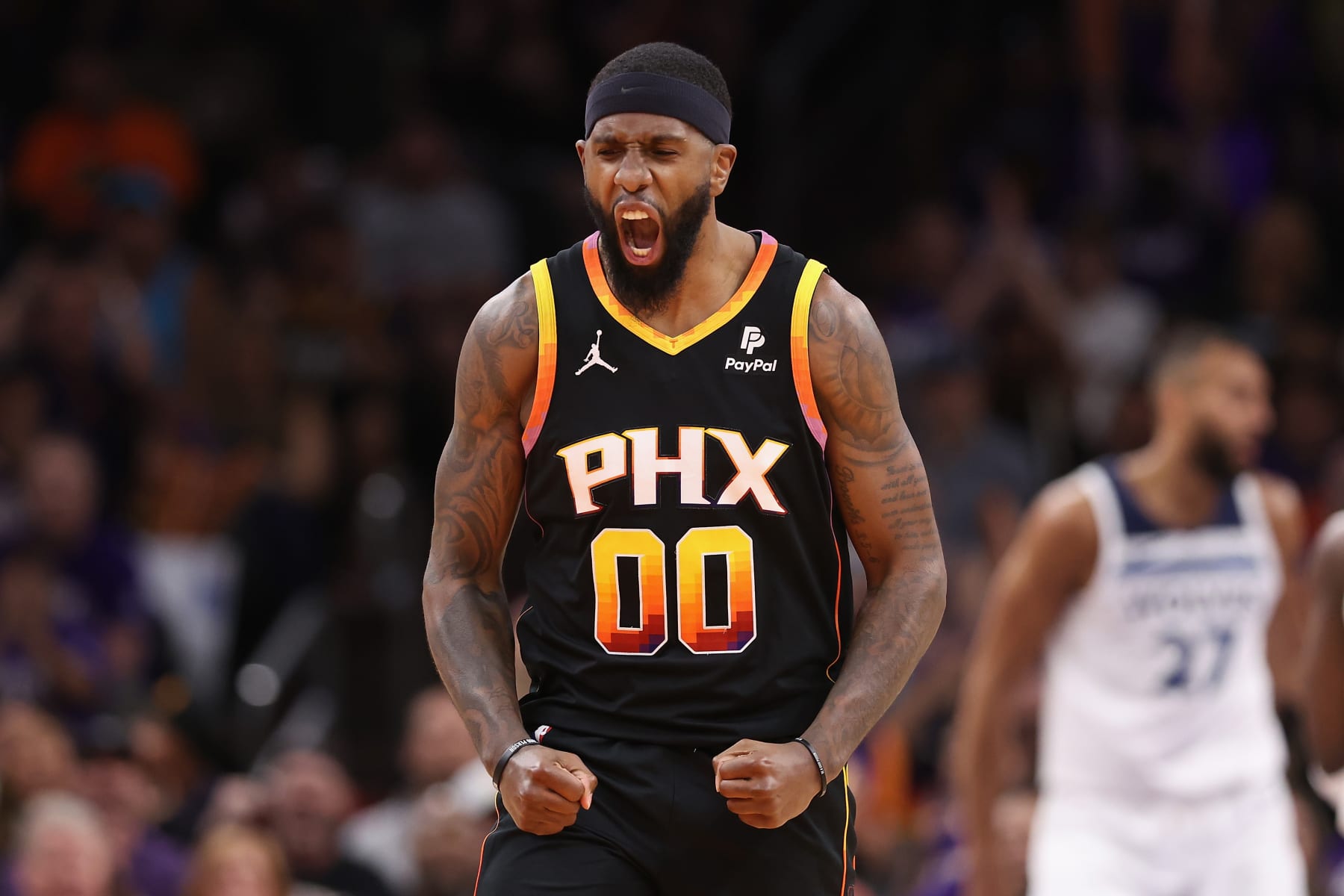 PHOENIX, ARIZONA - APRIL 28: Royce O'Neale #00 of the Phoenix Suns reacts to a three-point shot against the Minnesota Timberwolves during the first half of game four of the Western Conference First Round Playoffs at Footprint Center on April 28, 2024 in Phoenix, Arizona. NOTE TO USER: User expressly acknowledges and agrees that, by downloading and or using this photograph, User is consenting to the terms and conditions of the Getty Images License Agreement. (Photo by Christian Petersen/Getty Images)