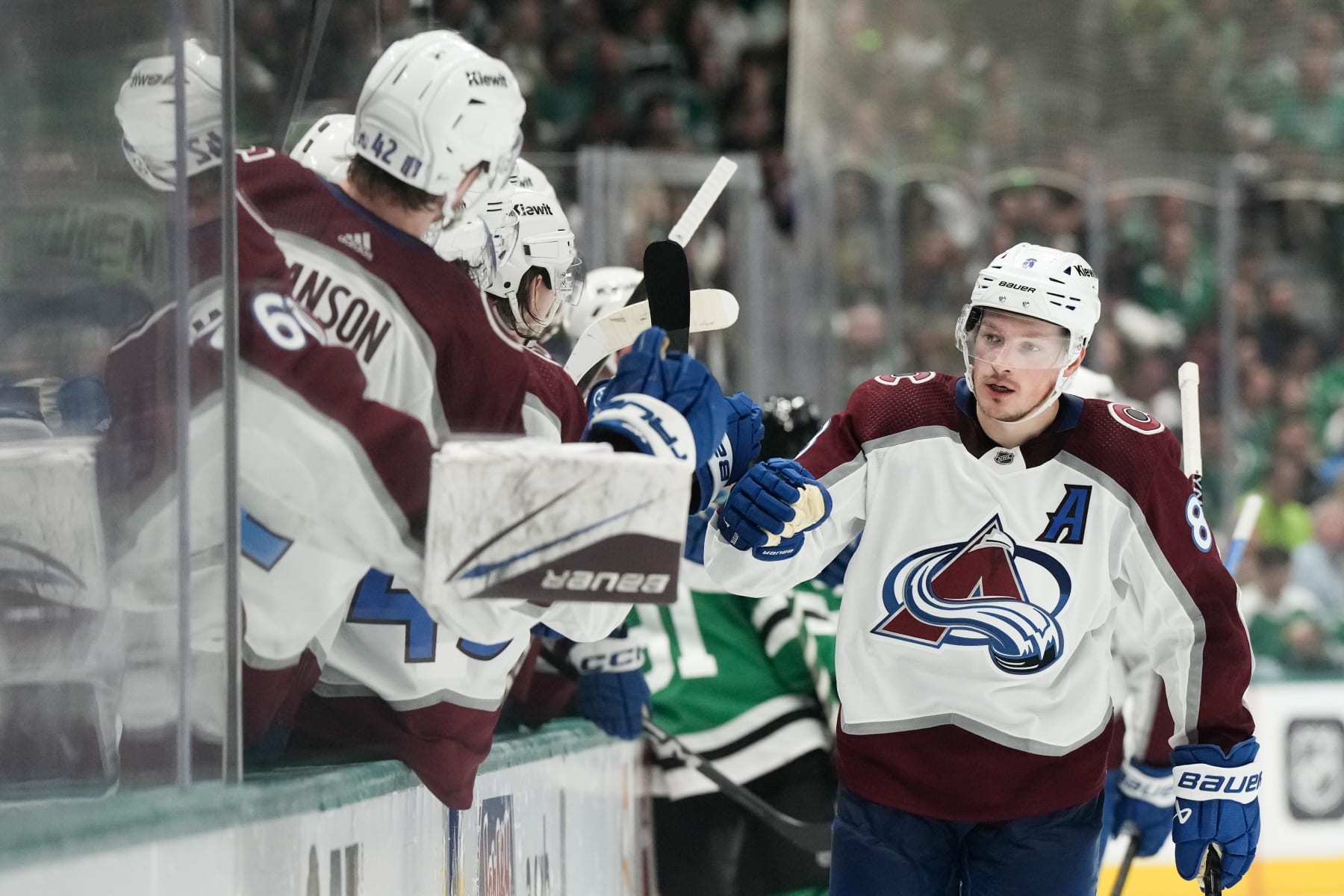 DALLAS, TEXAS - MAY 15: Cale Makar #8 of the Colorado Avalanche celebrates a goal against the Dallas Stars with teammates on the bench during the third period in Game Five of the Second Round of the 2024 Stanley Cup Playoffs at American Airlines Center on May 15, 2024 in Dallas, Texas. (Photo by Sam Hodde/Getty Images)