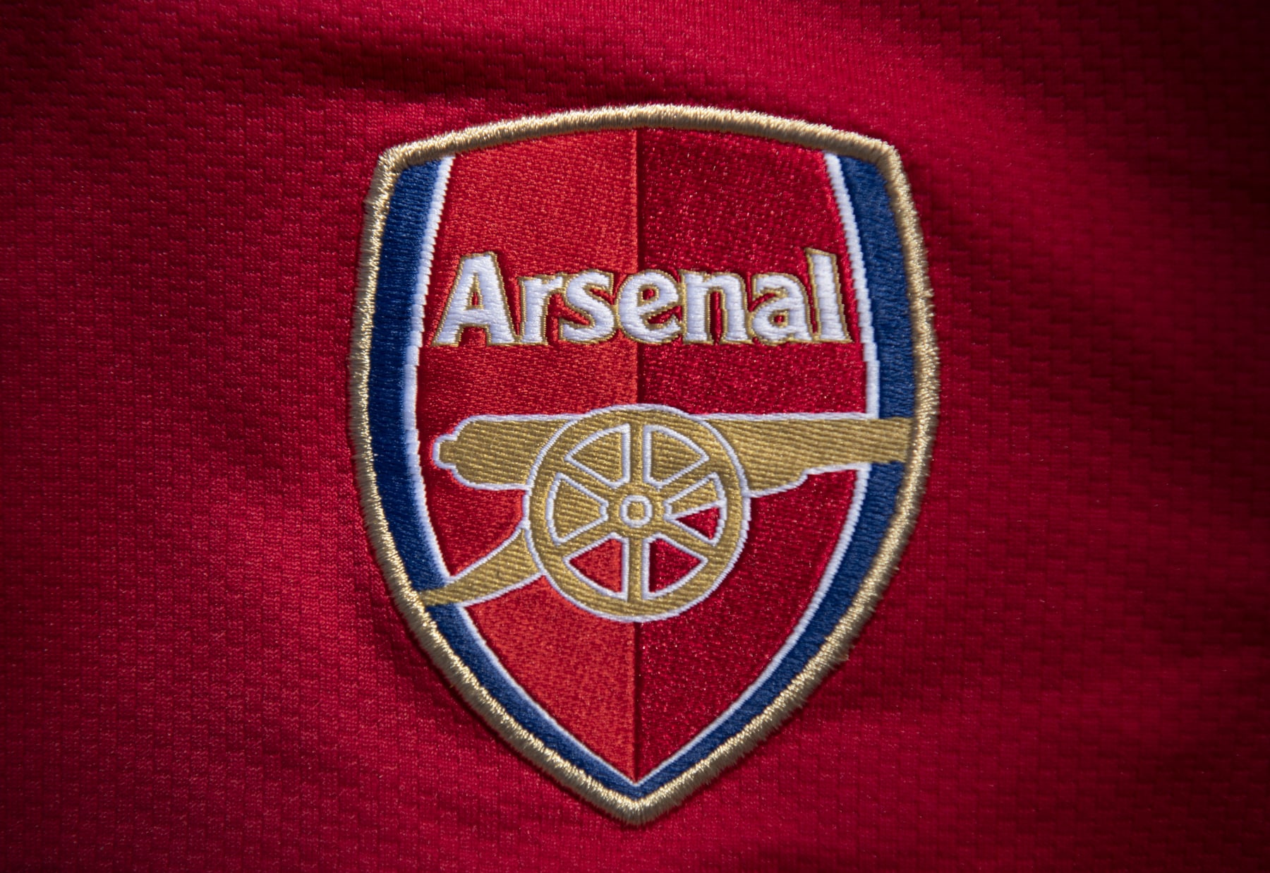 MANCHESTER, ENGLAND - MAY 06: The Arsenal club crest on the first team home shirt displayed on May 6, 2020 in Manchester, England (Photo by Visionhaus)