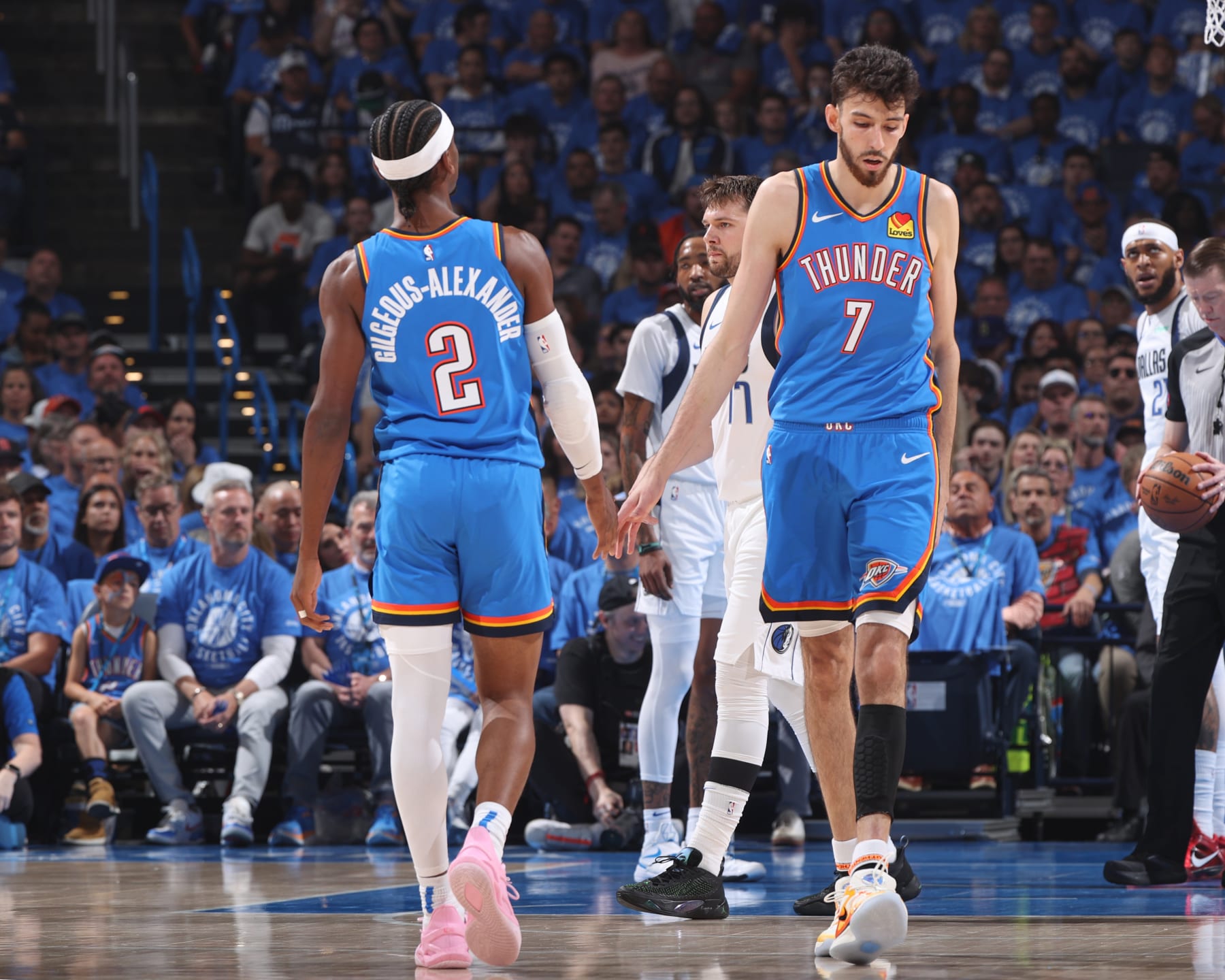 OKLAHOMA CITY, OK - MAY 9:  Shai Gilgeous-Alexander #2 of the Oklahoma City Thunder & Chet Holmgren #7 of the Oklahoma City Thunder high five during the game  against the Dallas Mavericks during Round 2 Game 2 of the 2024 NBA Playoffs  on May 9, 2024 at Paycom Arena in Oklahoma City, Oklahoma. NOTE TO USER: User expressly acknowledges and agrees that, by downloading and or using this photograph, User is consenting to the terms and conditions of the Getty Images License Agreement. Mandatory Copyright Notice: Copyright 2024 NBAE (Photo by Joe Murphy/NBAE via Getty Images)