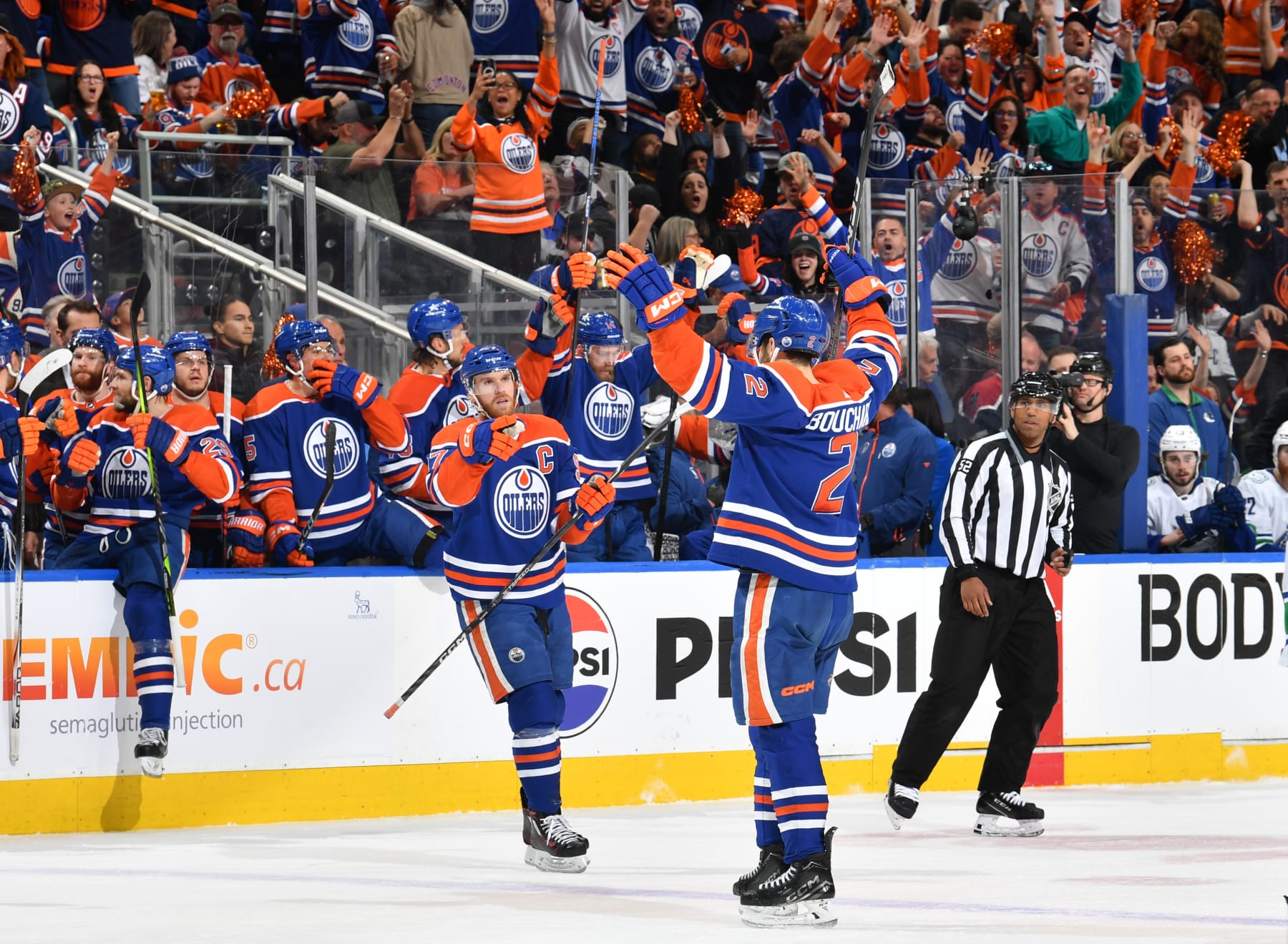 EDMONTON, CANADA - MAY 18: Evan Bouchard #2 of the Edmonton Oilers celebrates his second-period goal against the Vancouver Canucks with Connor McDavid #97 in Game Six of the Second Round of the 2024 Stanley Cup Playoffs at Rogers Place on May 18, 2024, in Edmonton, Alberta, Canada. (Photo by Andy Devlin/NHLI via Getty Images)
