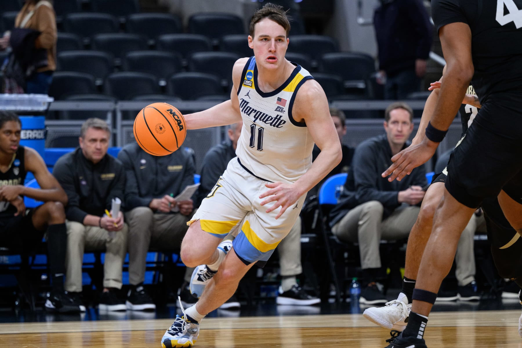 INDIANAPOLIS, IN - MARCH 24: Marquette Golden Eagles guard Tyler Kolek (11) drives baseline during the Marquette Golden Eagles versus the Colorado Buffaloes in the second round of the NCAA Division 1 Championship on March 24, 2024, at Gainbridge Fieldhouse in Indianapolis, IN. (Photo by Zach Bolinger/Icon Sportswire via Getty Images)
