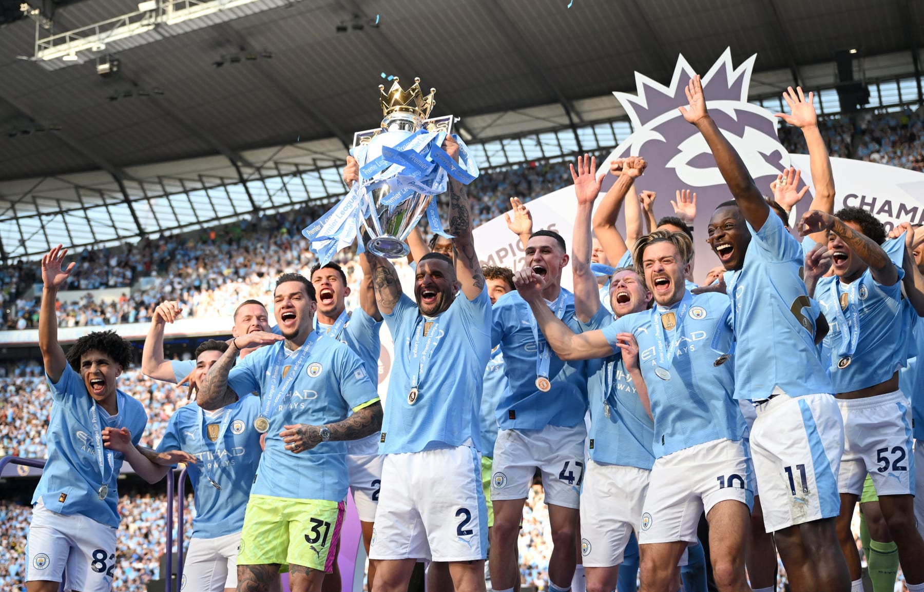 MANCHESTER, ENGLAND - MAY 19: Kyle Walker of Manchester City lifts the Premier League Trophy after their team's victory during the Premier League match between Manchester City and West Ham United at Etihad Stadium on May 19, 2024 in Manchester, England. (Photo by Michael Regan/Getty Images)