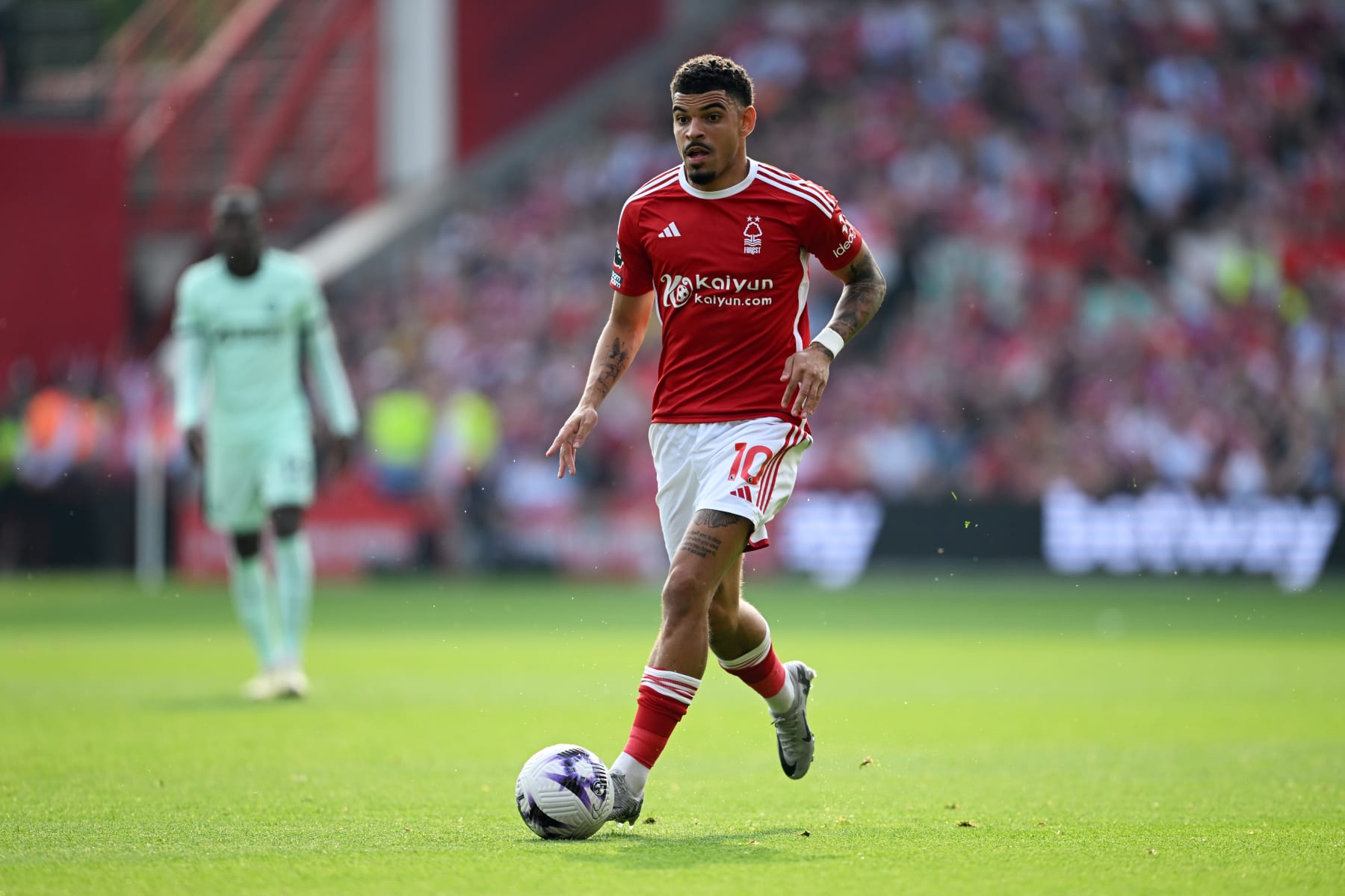 NOTTINGHAM, ENGLAND - MAY 11: Morgan Gibbs-White of Nottingham Forest runs with the ball during the Premier League match between Nottingham Forest and Chelsea FC at City Ground on May 11, 2024 in Nottingham, England. (Photo by Michael Regan/Getty Images)