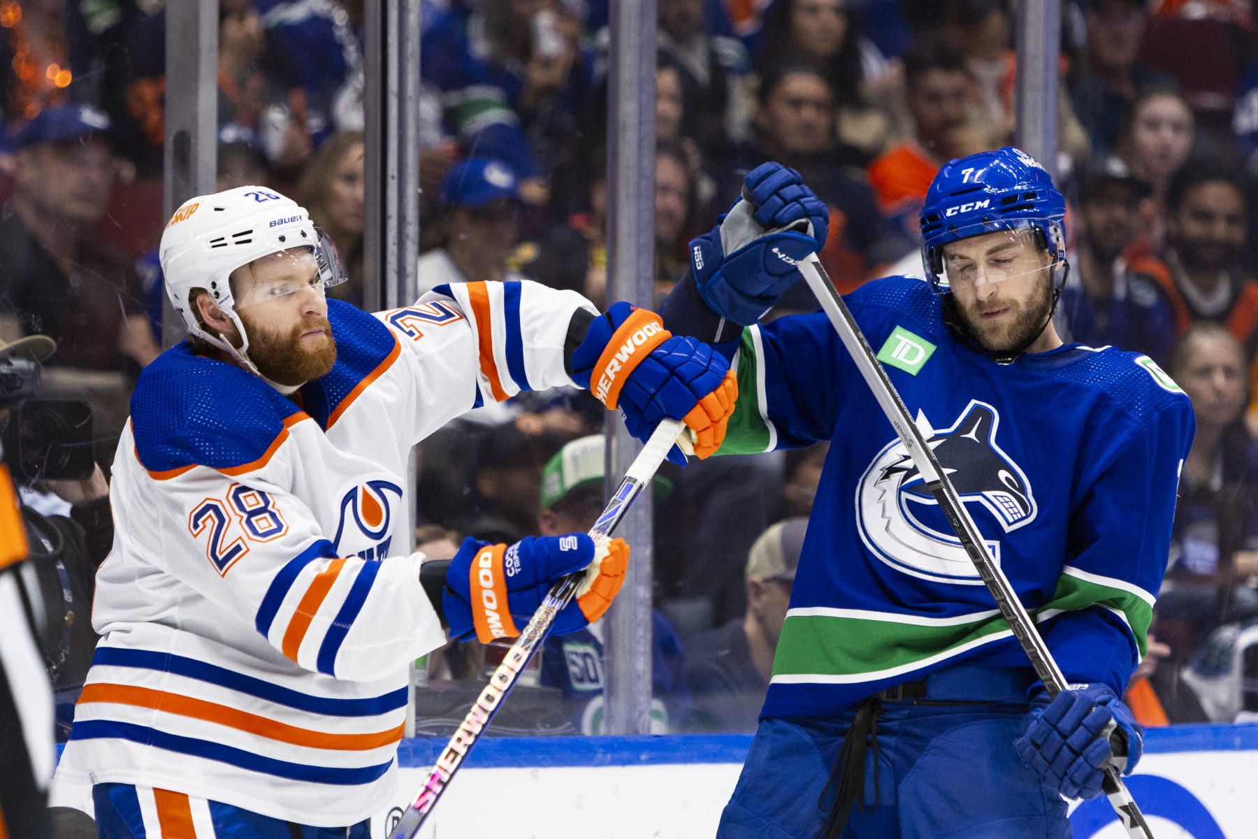 VANCOUVER, BC - MAY 20: Edmonton Oilers right wing Connor Brown (28) and Vancouver Canucks defenseman Carson Soucy (7) shown having a scuffle during Game Seven of the Second Round of the 2024 Stanley Cup playoffs between the Edmonton Oilers and the Vancouver Canucks on May 20, 2024, at Rogers Arena in Vancouver, B.C. (Photo by Jamie Douglas/Icon Sportswire via Getty Images)