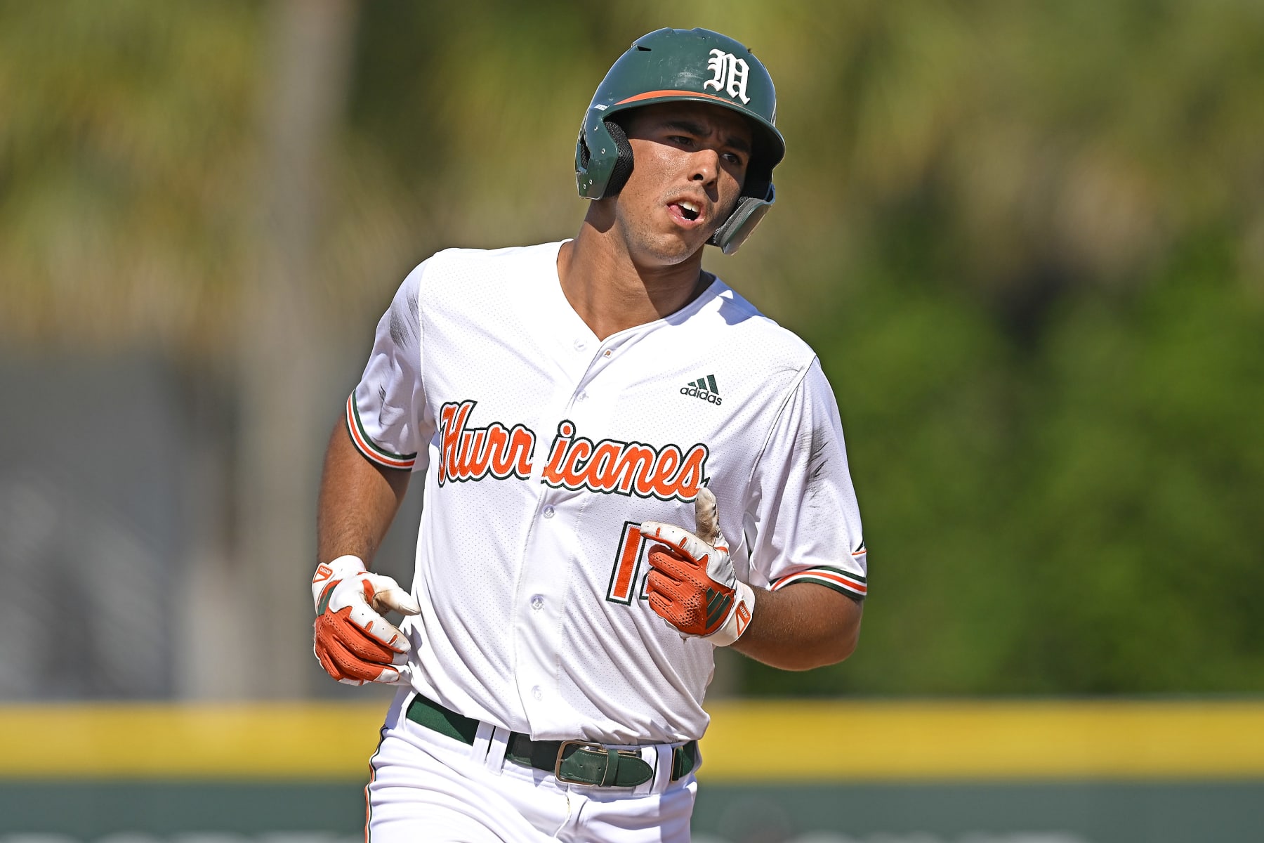 CORAL GABLES, FL - APRIL 21: Miami infielder Daniel Cuvet (14) rounds the bases after hitting a three-run home run in the sixth inning as the Miami Hurricanes faced the Louisville Cardinals on April 21, 2024, at Mark Light Field at Alex Rodriguez Park in Coral Gables, Florida. (Photo by Samuel Lewis/Icon Sportswire via Getty Images)