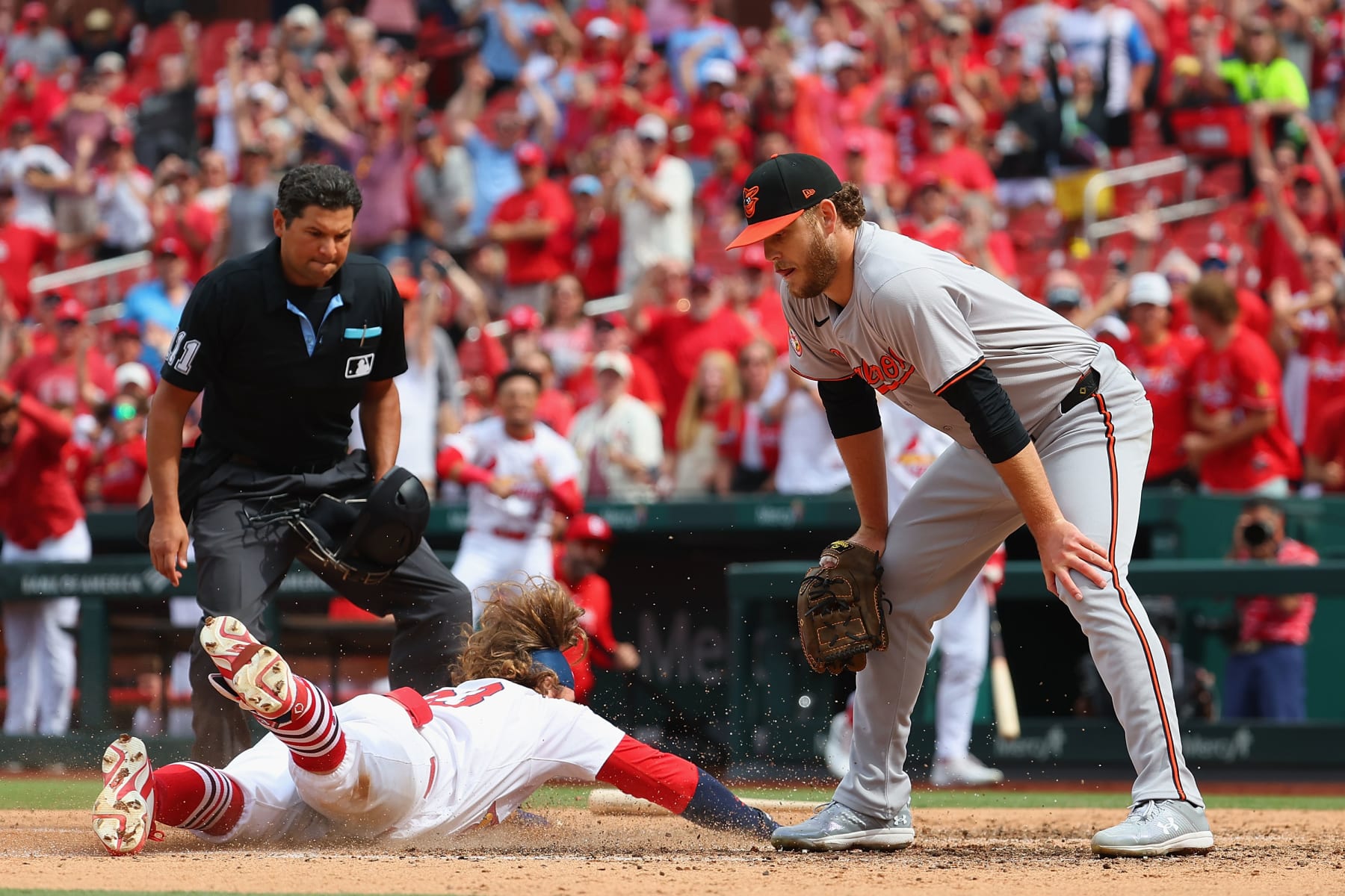 ST LOUIS, MISSOURI - MAY 22: Brendan Donovan #33 of the St. Louis Cardinals scores a run against Cole Irvin #19 of the Baltimore Orioles in the sixth inning at Busch Stadium on May 22, 2024 in St Louis, Missouri. (Photo by Dilip Vishwanat/Getty Images)