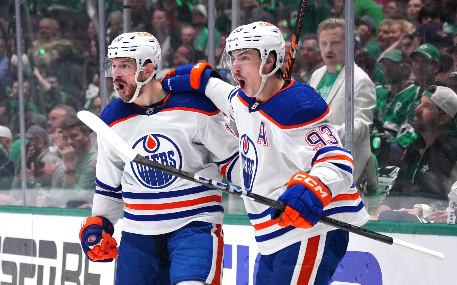 DALLAS, TEXAS - MAY 23: Zach Hyman #18 celebrates with Ryan Nugent-Hopkins #93 of the Edmonton Oilers after Hyman's goal against the Dallas Stars during the second period in Game One of the Western Conference Final of the 2024 Stanley Cup Playoffs at American Airlines Center on May 23, 2024 in Dallas, Texas.  (Photo by Cooper Neill/Getty Images)