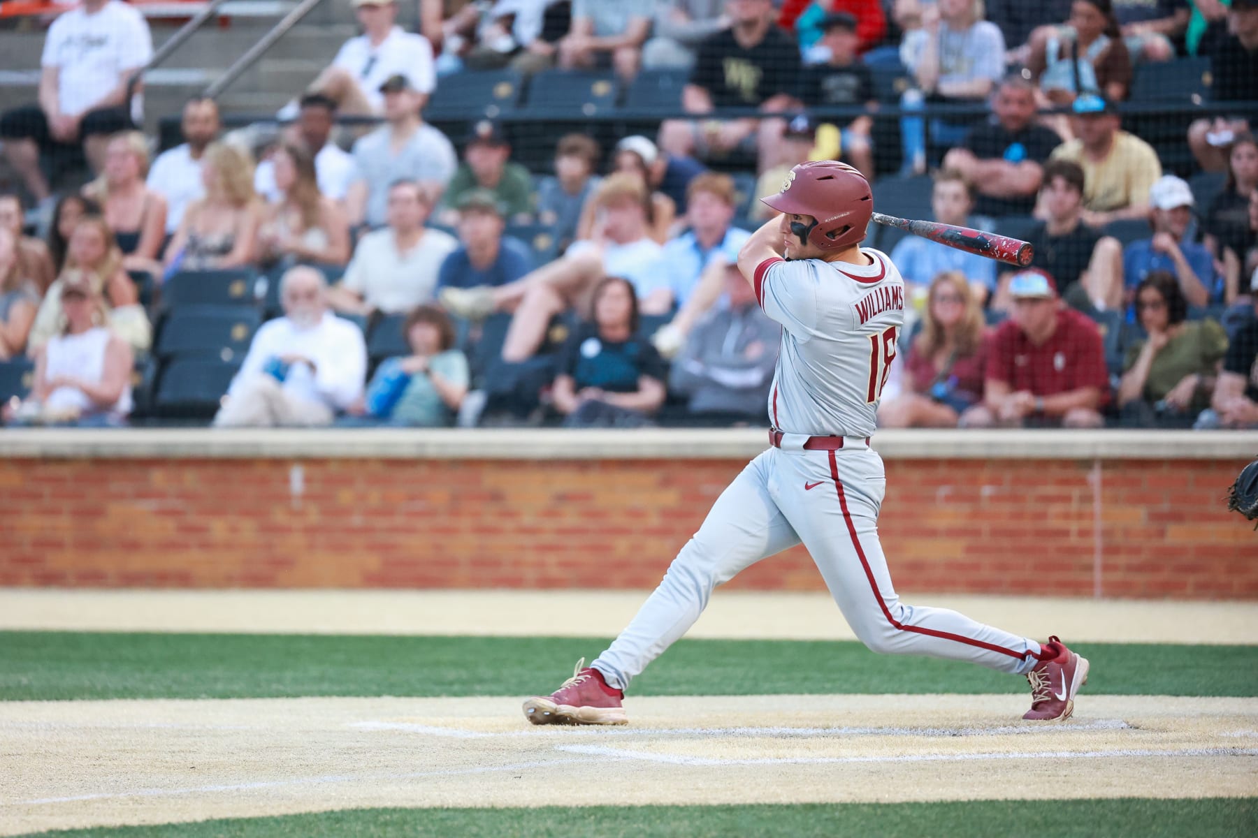 WINSTON SALEM, NORTH CAROLINA - APRIL 19: Max Williams #18 of the Florida State Seminoles makes a swing against the Wake Forest Demon Deacons at David F. Couch Ballpark on April 19, 2024 in Winston Salem, North Carolina. (Photo by Isaiah Vazquez/Getty Images)