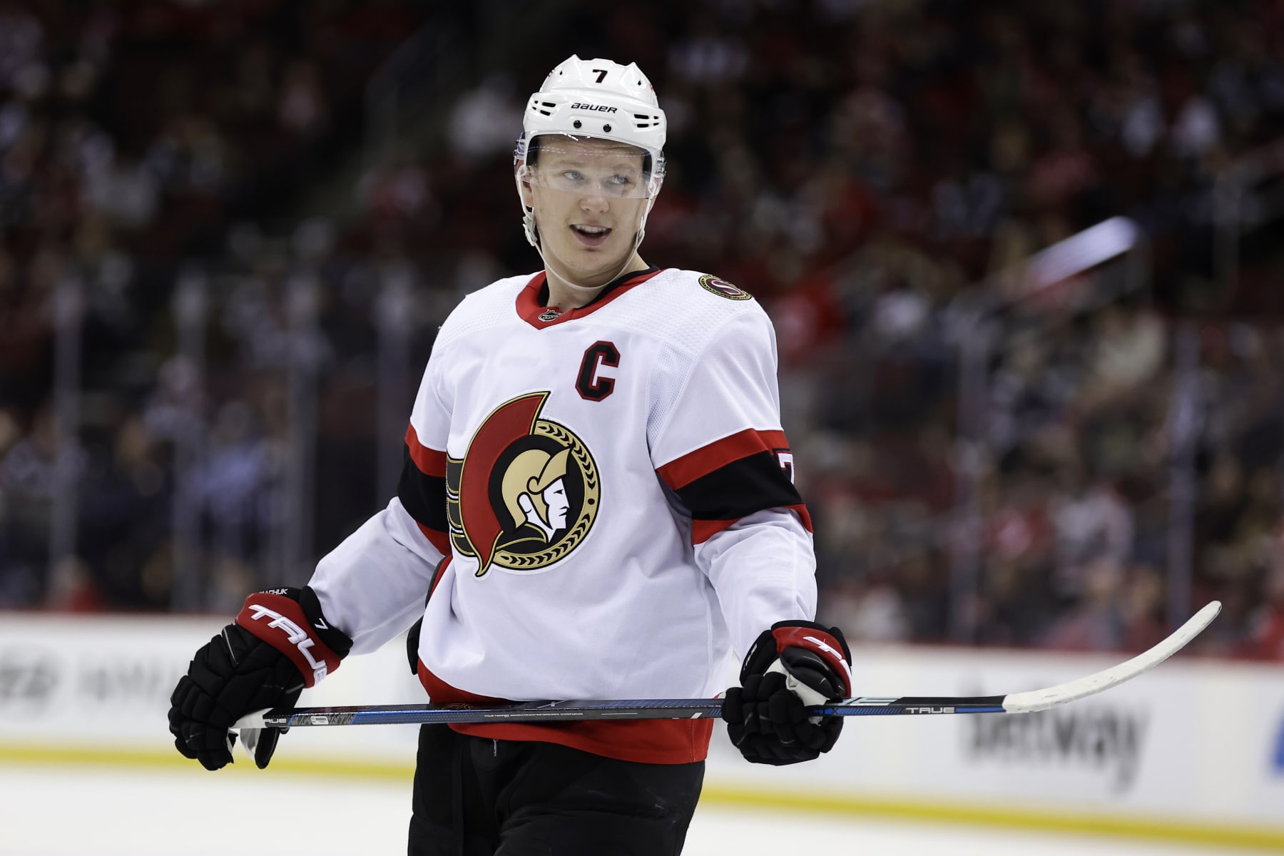 NEWARK, NEW JERSEY - MARCH 23: Brady Tkachuk #7 of the Ottawa Senators reacts during a break in play against the New Jersey Devils during the third period at the Prudential Center on March 23, 2024 in Newark, New Jersey. The Senators won 5-2. (Photo by Adam Hunger/Getty Images)