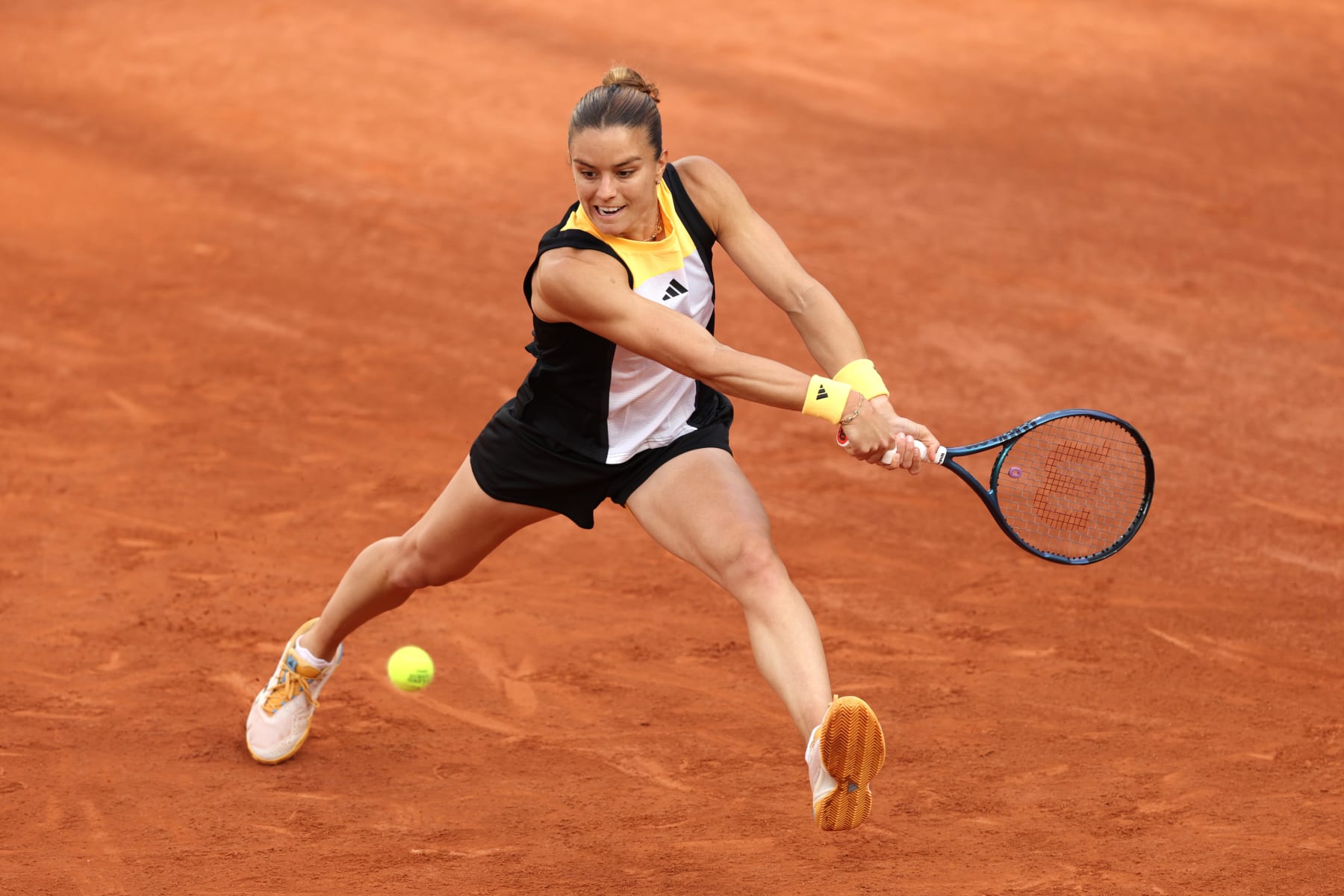 PARIS, FRANCE - MAY 27: Maria Sakkari of Greece plays a backhand against Varvara Gracheva of France in the Women's Singles first round match on Day Two of the 2024 French Open at Roland Garros on May 27, 2024 in Paris, France. (Photo by Clive Brunskill/Getty Images)