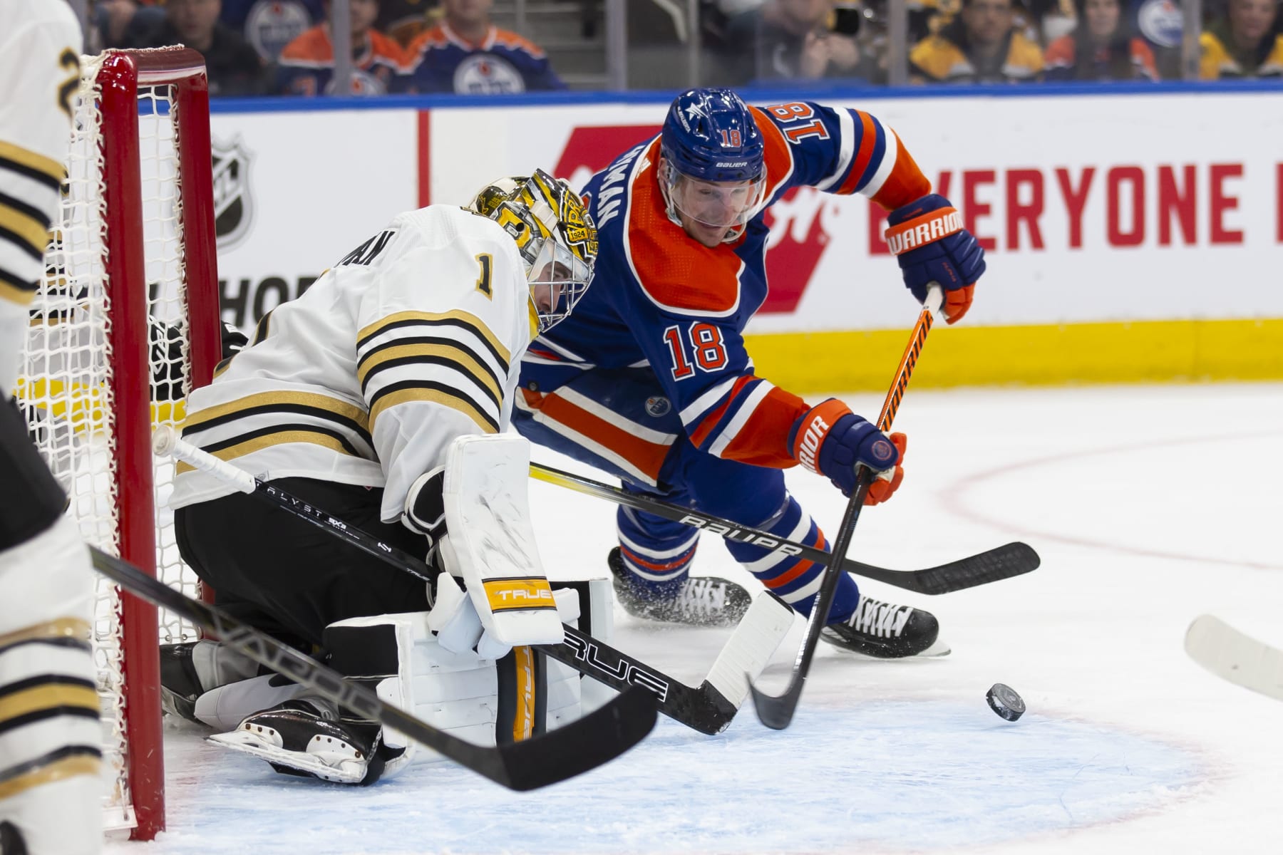 EDMONTON, CANADA - FEBRUARY 21: Zach Hyman #18 of the Edmonton Oilers goes for a wraparound against goaltender Jeremy Swayman #1 of the Boston Bruins during the second period at Rogers Place on February 21, 2024 in Edmonton, Canada. (Photo by Codie McLachlan/Getty Images)
