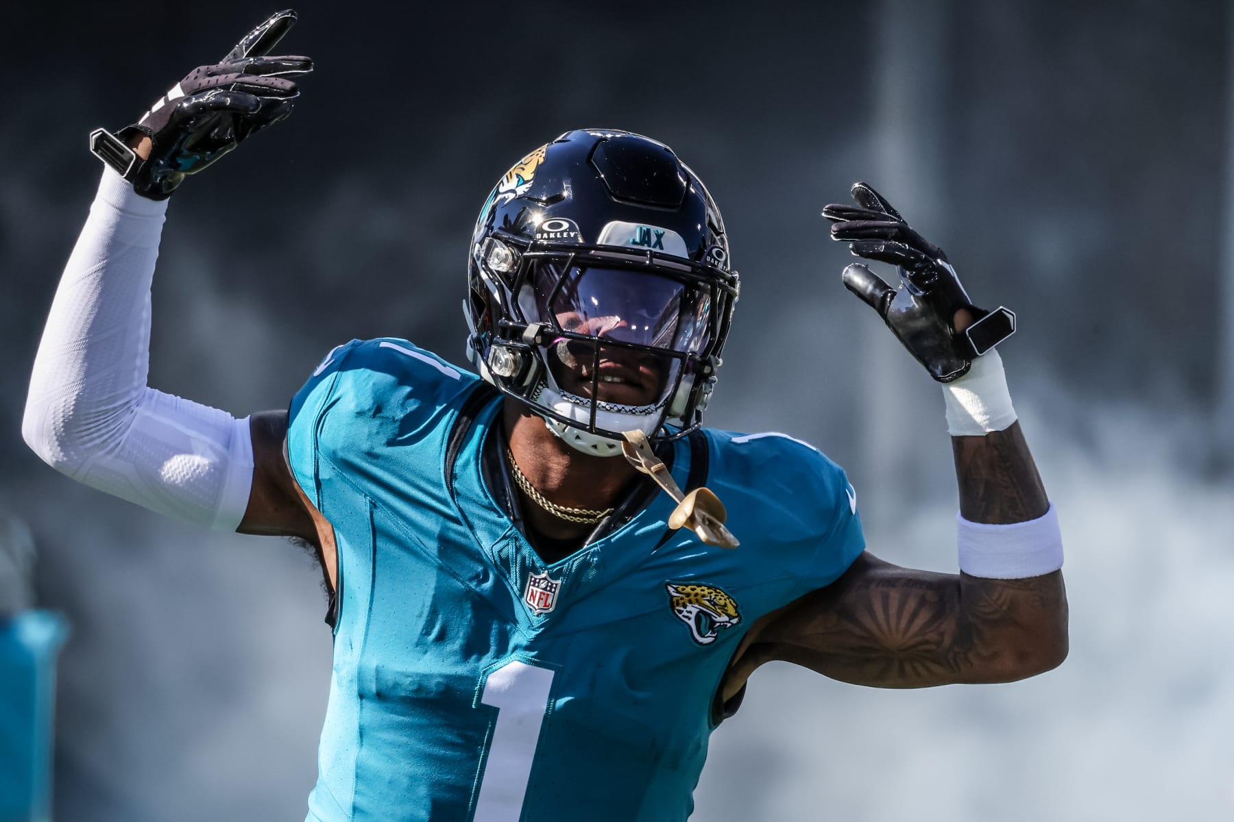 JACKSONVILLE, FLORIDA - DECEMBER 31: Travis Etienne Jr. #1 of the Jacksonville Jaguars runs out for introductions before the game against the Carolina Panthers at EverBank Stadium on December 31, 2023 in Jacksonville, Florida. (Photo by Mike Carlson/Getty Images)