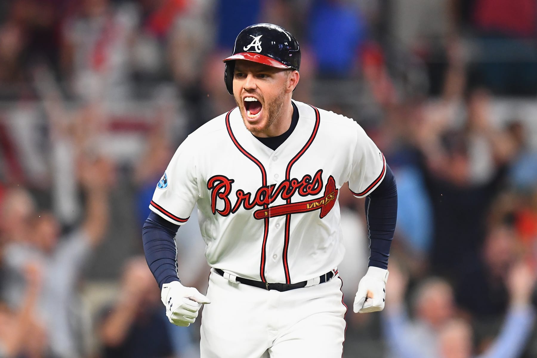 ATLANTA, GA - OCTOBER 07:  Freddie Freeman #5 of the Atlanta Braves reacts after hitting a solo home run in the sixth inning against the Los Angeles Dodgers during Game Three of the National League Division Series at SunTrust Park on October 7, 2018 in Atlanta, Georgia.  (Photo by Scott Cunningham/Getty Images)