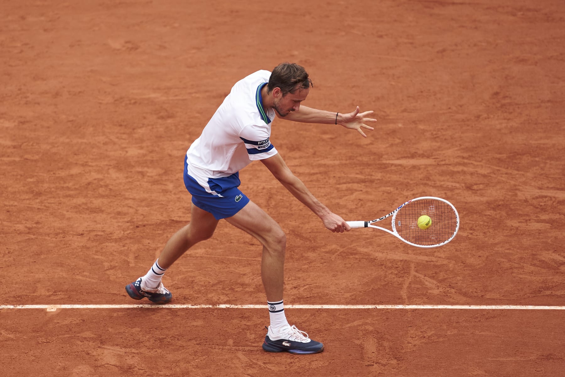 PARIS, FRANCE - MAY 30: Daniil Medvedev plays a backhand against Miomir Kecmanovic of Serbia in the Men's Singles second round match on Day Five of the 2024 French Open at at Roland Garros on May 30, 2024 in Paris, France. (Photo by Mateo Villalba/Getty Images)