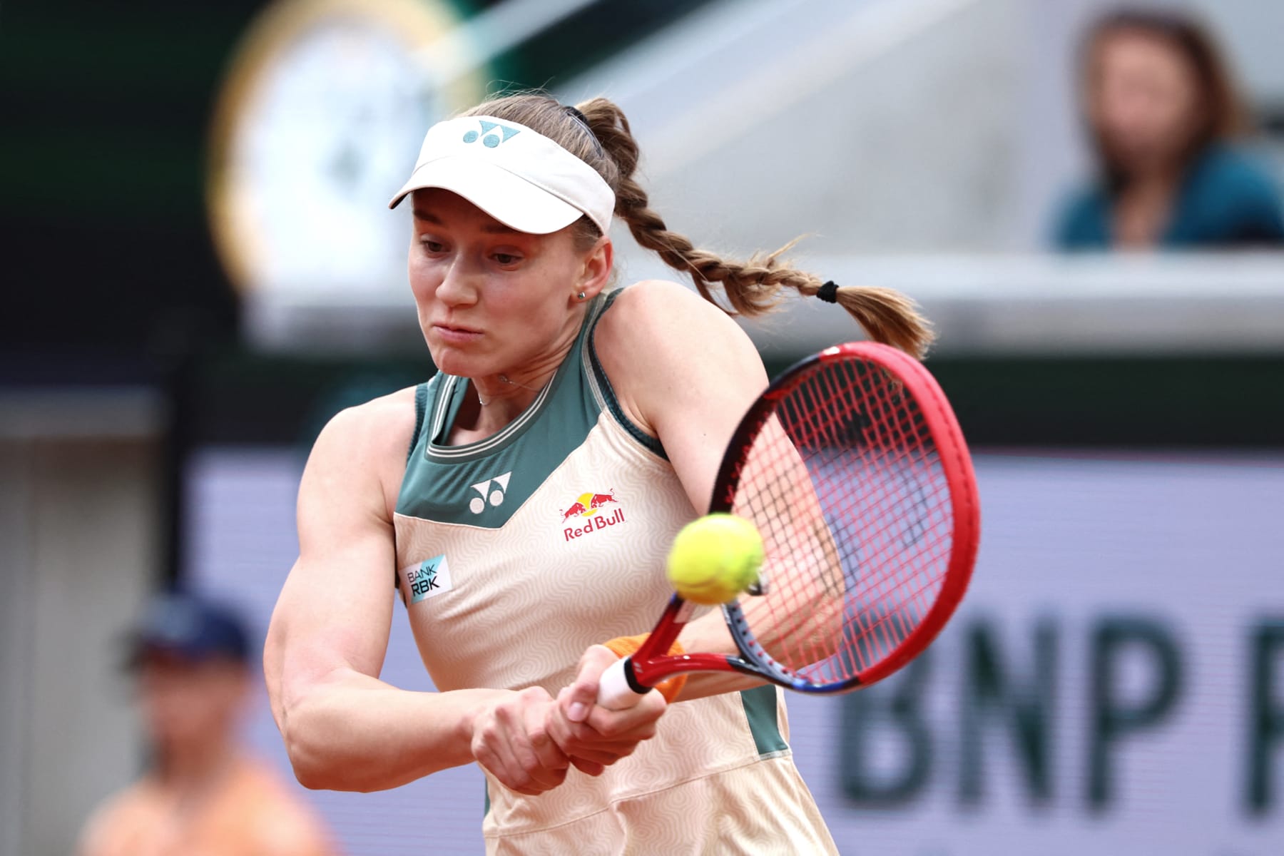Kazakhstan's Elena Rybakina plays a backhand return to Netherlands' Arantxa Rus during their women's singles match on Court Suzanne-Lenglen on day five of the French Open tennis tournament at the Roland Garros Complex in Paris on May 30, 2024. (Photo by EMMANUEL DUNAND / AFP) (Photo by EMMANUEL DUNAND/AFP via Getty Images)