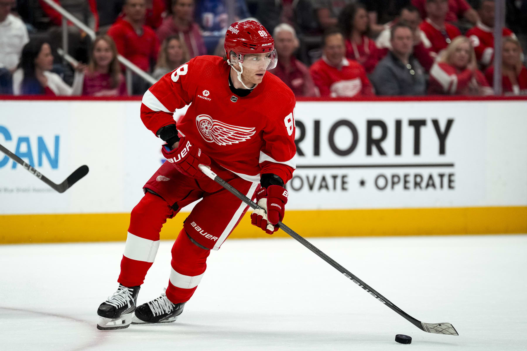 DETROIT, MICHIGAN - APRIL 09: Patrick Kane #88 of the Detroit Red Wings handles the puck against the Washington Capitals during the first period at Little Caesars Arena on April 09, 2024 in Detroit, Michigan. (Photo by Nic Antaya/Getty Images)