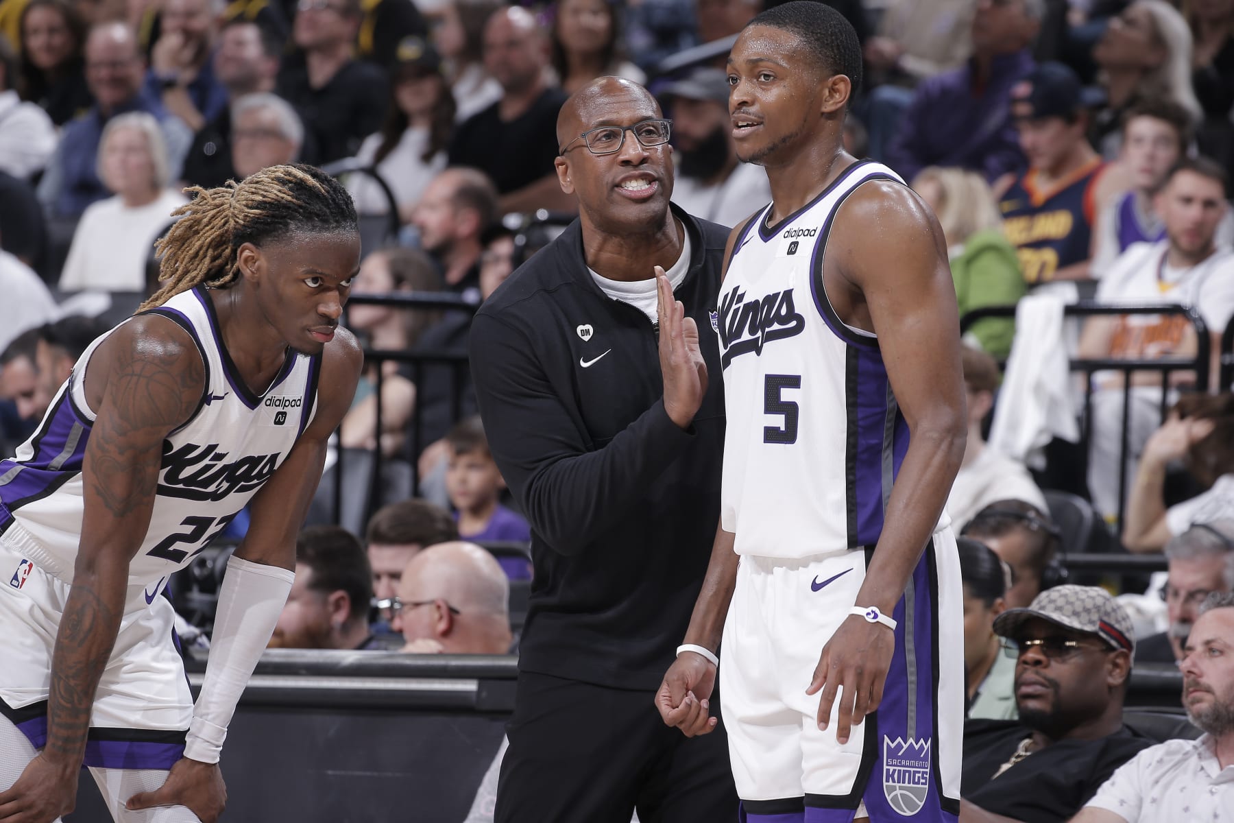 SACRAMENTO, CA - APRIL 16: Head Coach Mike Brown of the Sacramento Kings coaches De'Aaron Fox #5 and Keon Ellis #23 during the game against the Golden State Warriors during the 2024 Play-In Tournament on April 16, 2024 at Golden 1 Center in Sacramento, California. NOTE TO USER: User expressly acknowledges and agrees that, by downloading and or using this photograph, User is consenting to the terms and conditions of the Getty Images Agreement. Mandatory Copyright Notice: Copyright 2024 NBAE (Photo by Rocky Widner/NBAE via Getty Images)