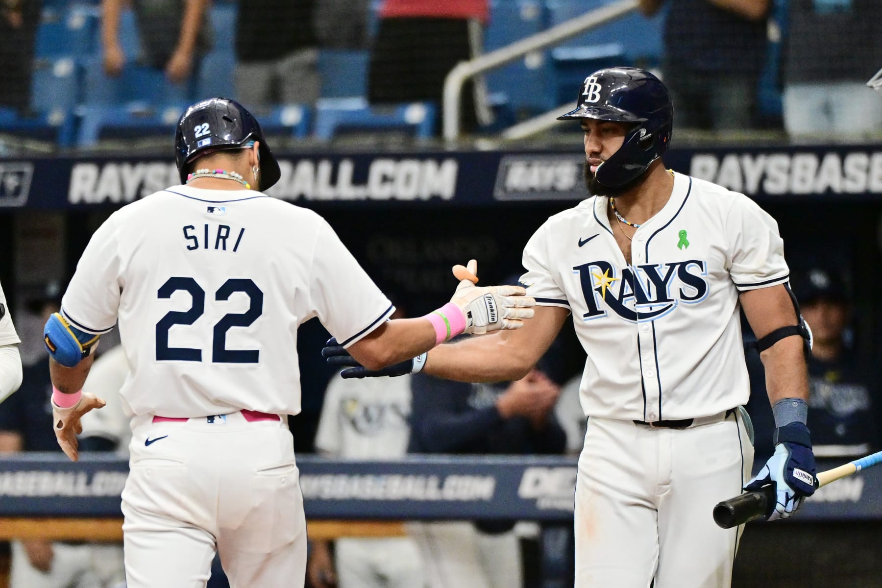 ST PETERSBURG, FLORIDA - MAY 30: Jose Siri #22 of the Tampa Bay Rays celebrates with Amed Rosario #10 after hitting a home run in the ninth inning against the Oakland Athletics at Tropicana Field on May 30, 2024 in St Petersburg, Florida. (Photo by Julio Aguilar/Getty Images)