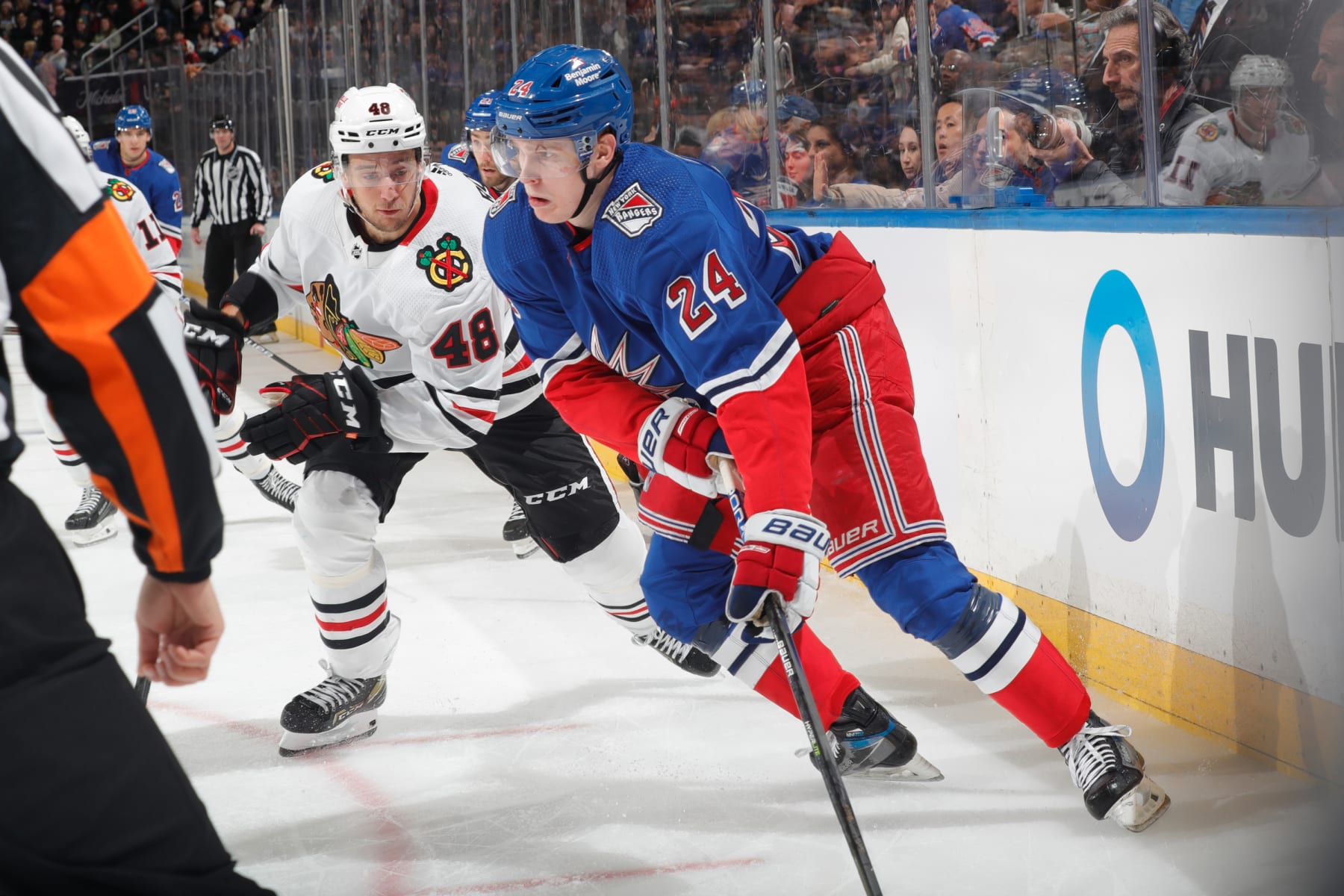 NEW YORK, NEW YORK - DECEMBER 03: Kaapo Kakko #24 of the New York Rangers skates with the puck against Filip Roos #48 of the Chicago Blackhawks at Madison Square Garden on December 3, 2022 in New York City. (Photo by Jared Silber/NHLI via Getty Images)