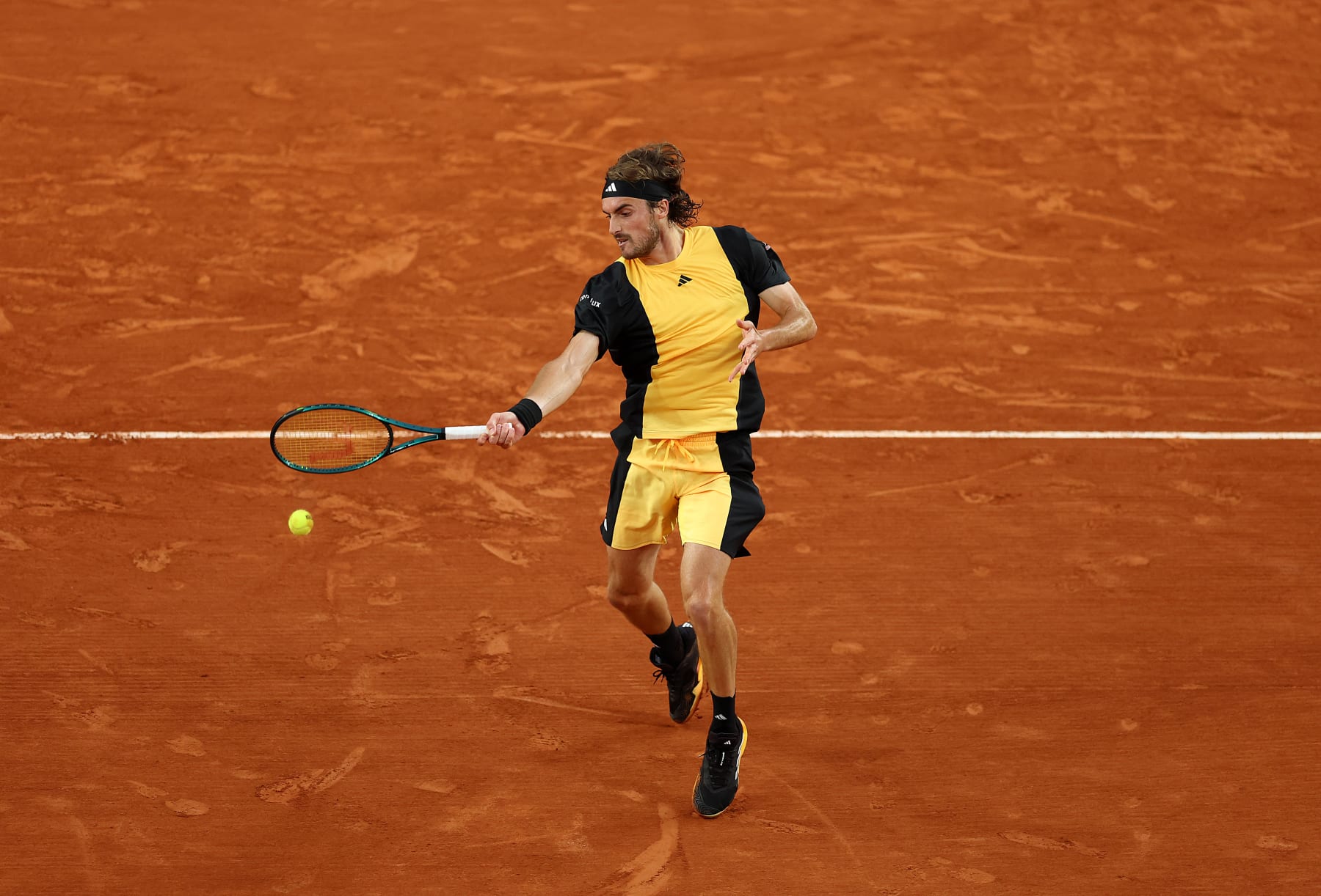PARIS, FRANCE - MAY 31: Stefanos Tsitsipas of Greece plays a forehand against Zhang Zhizhen of China in the Men's Singles Third Round match during Day Six of the 2024 French Open at Roland Garros on May 31, 2024 in Paris, France. (Photo by Clive Brunskill/Getty Images)