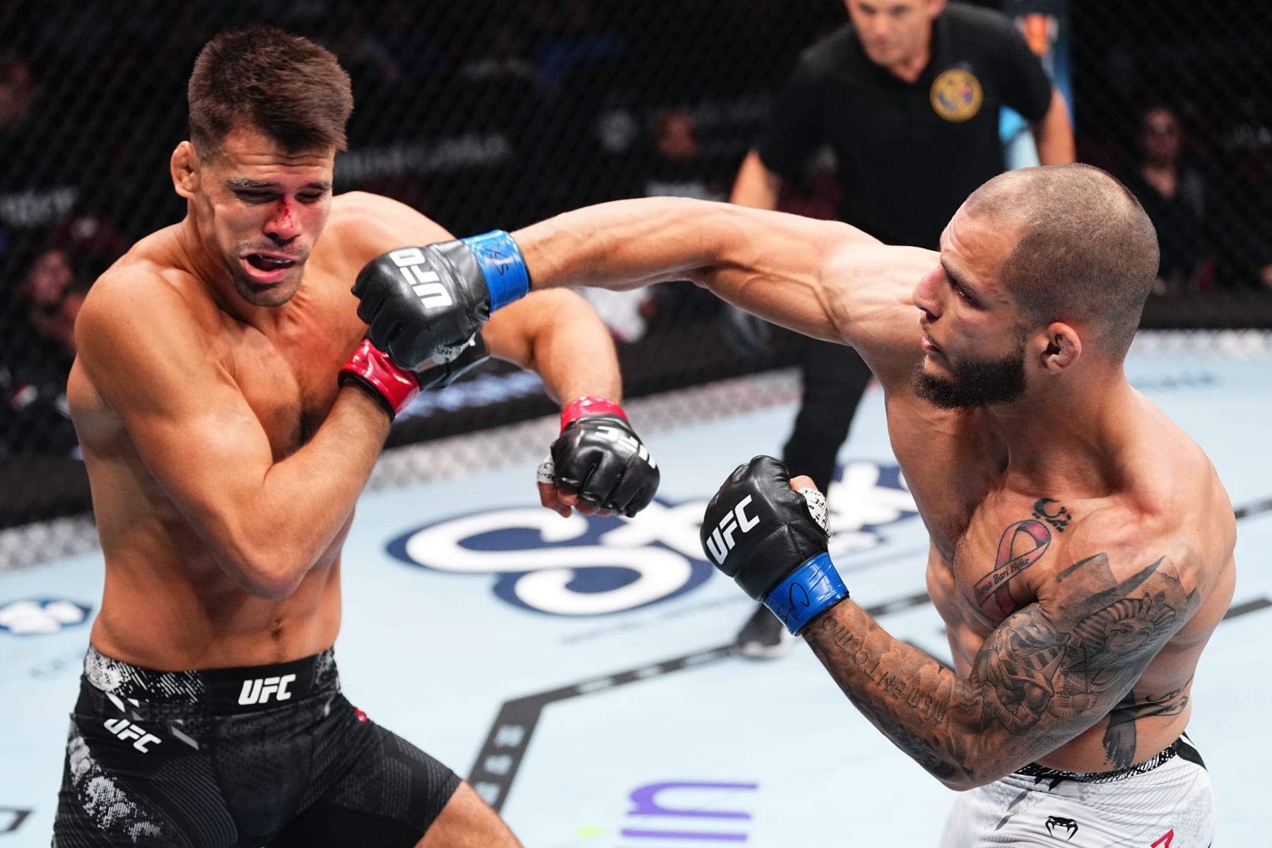 NEWARK, NEW JERSEY - JUNE 01: (R-L) Bassil Hafez punches Mickey Gall in a welterweight fight during the UFC 302 event at Prudential Center on June 01, 2024 in Newark, New Jersey. (Photo by Jeff Bottari/Zuffa LLC via Getty Images)