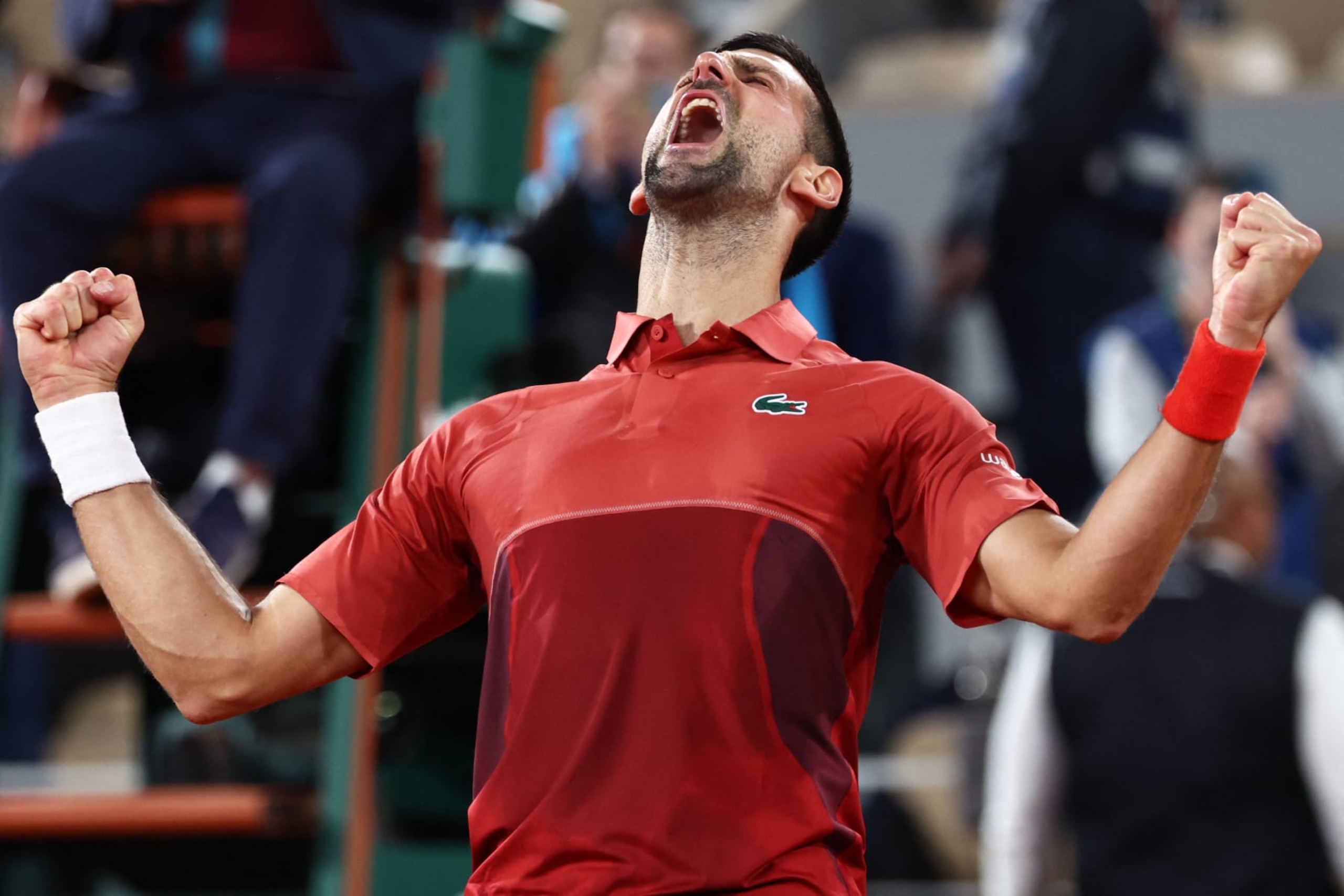 Serbia's Novak Djokovic celebrates after winning against Italy's Lorenzo Musetti with a timer reading 4 hours and 28 minutes at the end of their men's singles match on Court Philippe-Chatrier on day seven of the French Open tennis tournament at the Roland Garros Complex in Paris on June 2, 2024. (Photo by EMMANUEL DUNAND / AFP) (Photo by EMMANUEL DUNAND/AFP via Getty Images) Serbia's Novak Djokovic celebrates after winning against Italy's Lorenzo Musetti with a timer reading 4 hours and 28 minutes at the end of their men's singles match on Court Philippe-Chatrier on day seven of the French Open tennis tournament at the Roland Garros Complex in Paris on June 2, 2024. (Photo by EMMANUEL DUNAND / AFP) (Photo by EMMANUEL DUNAND/AFP via Getty Images)