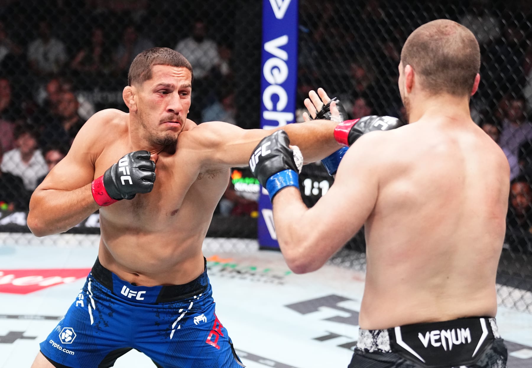 NEWARK, NEW JERSEY - JUNE 01: (L-R) Niko Price punches Alex Morono in a welterweight fight during the UFC 302 event at Prudential Center on June 01, 2024 in Newark, New Jersey. (Photo by Jeff Bottari/Zuffa LLC via Getty Images)