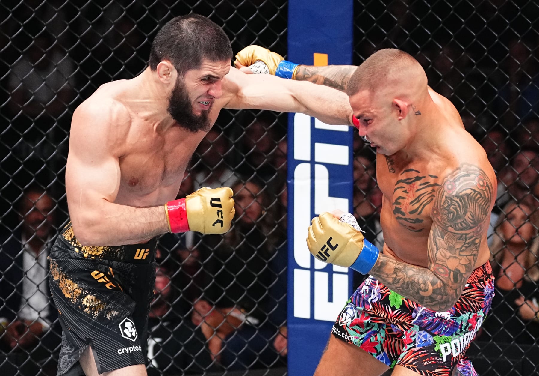 NEWARK, NEW JERSEY - JUNE 01: (L-R) Islam Makhachev of Russia punches Dustin Poirier in the UFC lightweight championship fight during the UFC 302 event at Prudential Center on June 01, 2024 in Newark, New Jersey. (Photo by Jeff Bottari/Zuffa LLC via Getty Images)