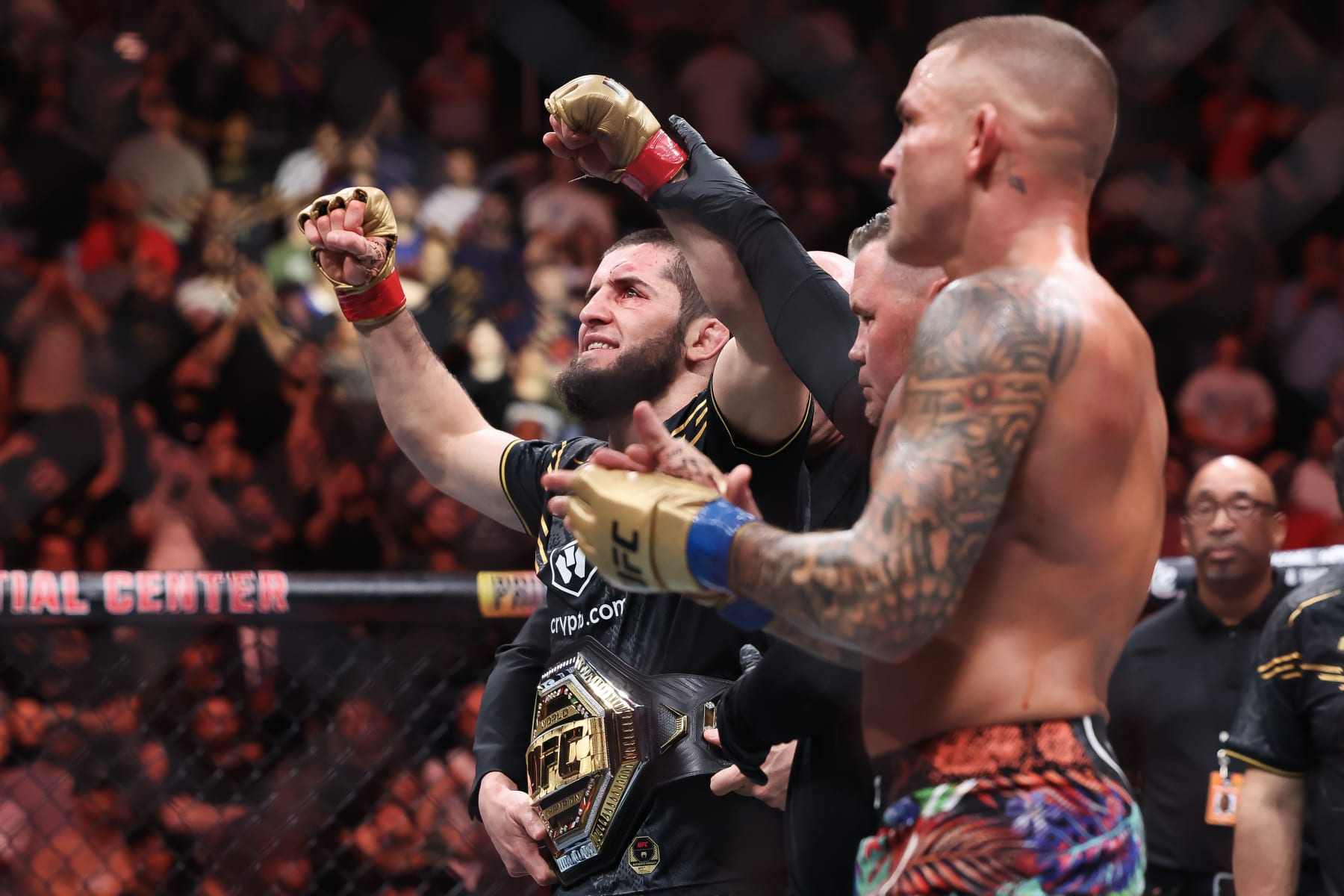 Islam Makhachev celebrates defeating Dustin Poirier