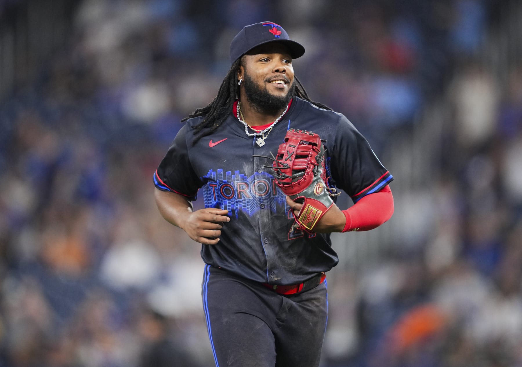 TORONTO, ON - MAY 31: Vladimir Guerrero Jr. #27 of Toronto Blue Jays smiles as he comes off the field against the Pittsburgh Pirates during the fourteenth inning in their MLB game at the Rogers Centre on May 31, 2024 in Toronto, Ontario, Canada. (Photo by Mark Blinch/Getty Images)
