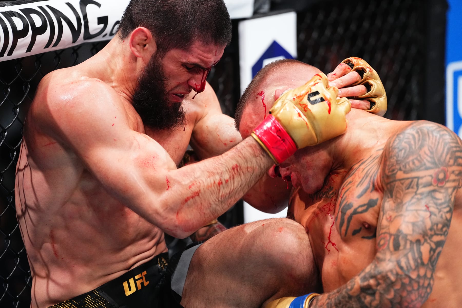 NEWARK, NEW JERSEY - JUNE 01: (L-R) Islam Makhachev of Russia battles Dustin Poirier in the UFC lightweight championship fight during the UFC 302 event at Prudential Center on June 01, 2024 in Newark, New Jersey. (Photo by Jeff Bottari/Zuffa LLC via Getty Images)
