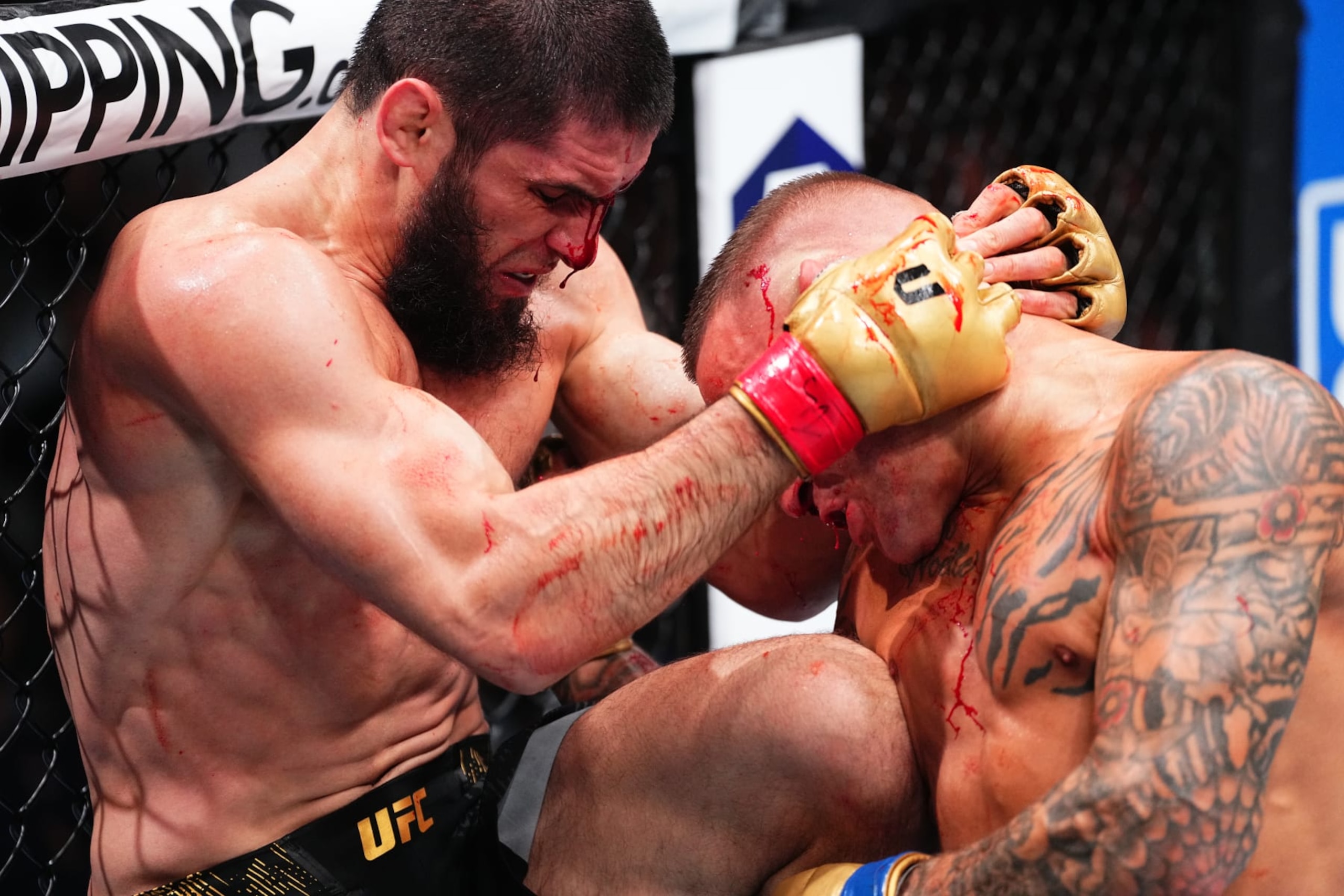 NEWARK, NEW JERSEY - JUNE 01: (L-R) Islam Makhachev of Russia battles Dustin Poirier in the UFC lightweight championship fight during the UFC 302 event at Prudential Center on June 01, 2024 in Newark, New Jersey. (Photo by Jeff Bottari/Zuffa LLC via Getty Images)