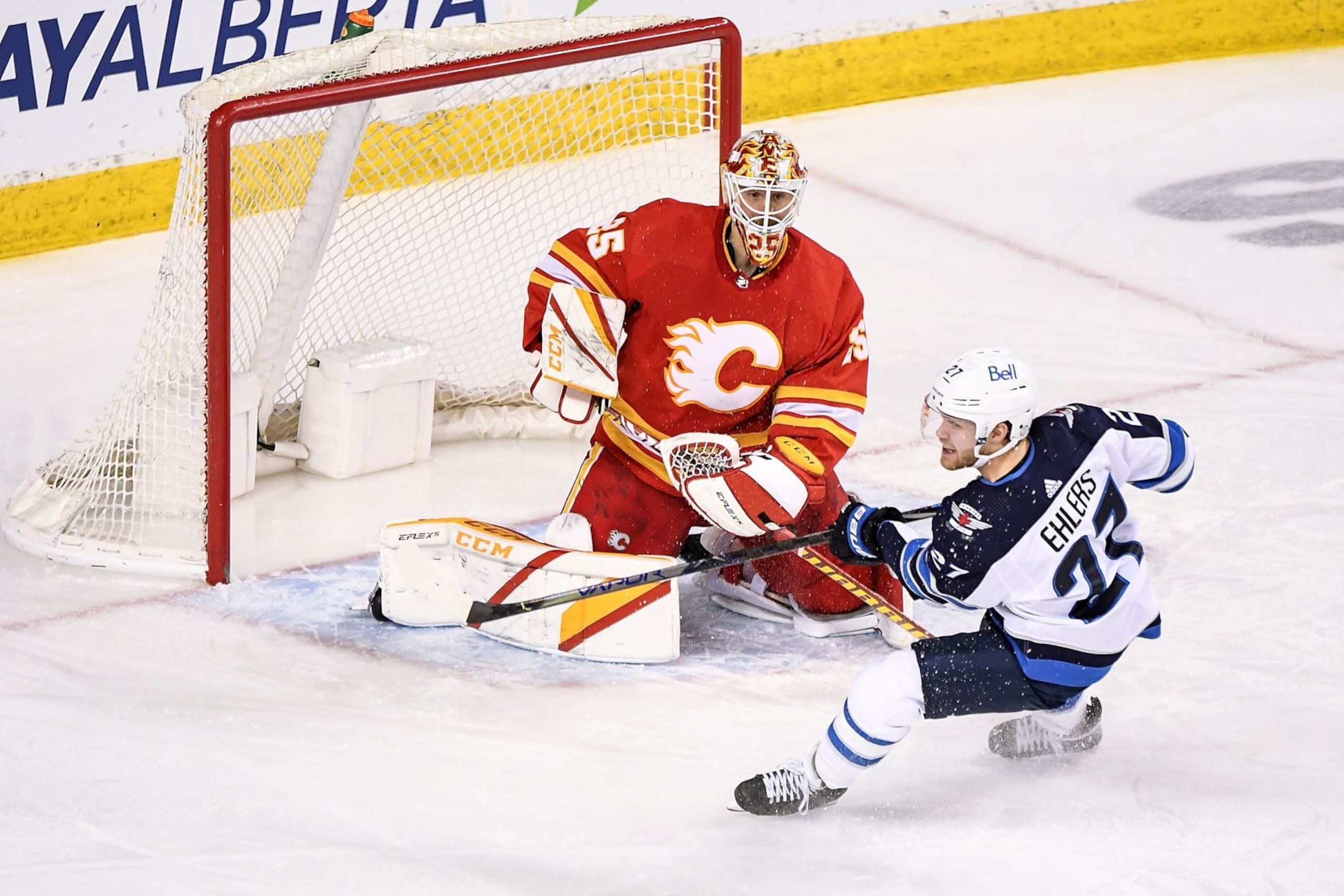 Calgary Flames goaltender Jacob Markström and Winnipeg Jets winger Nikolaj Ehlers.