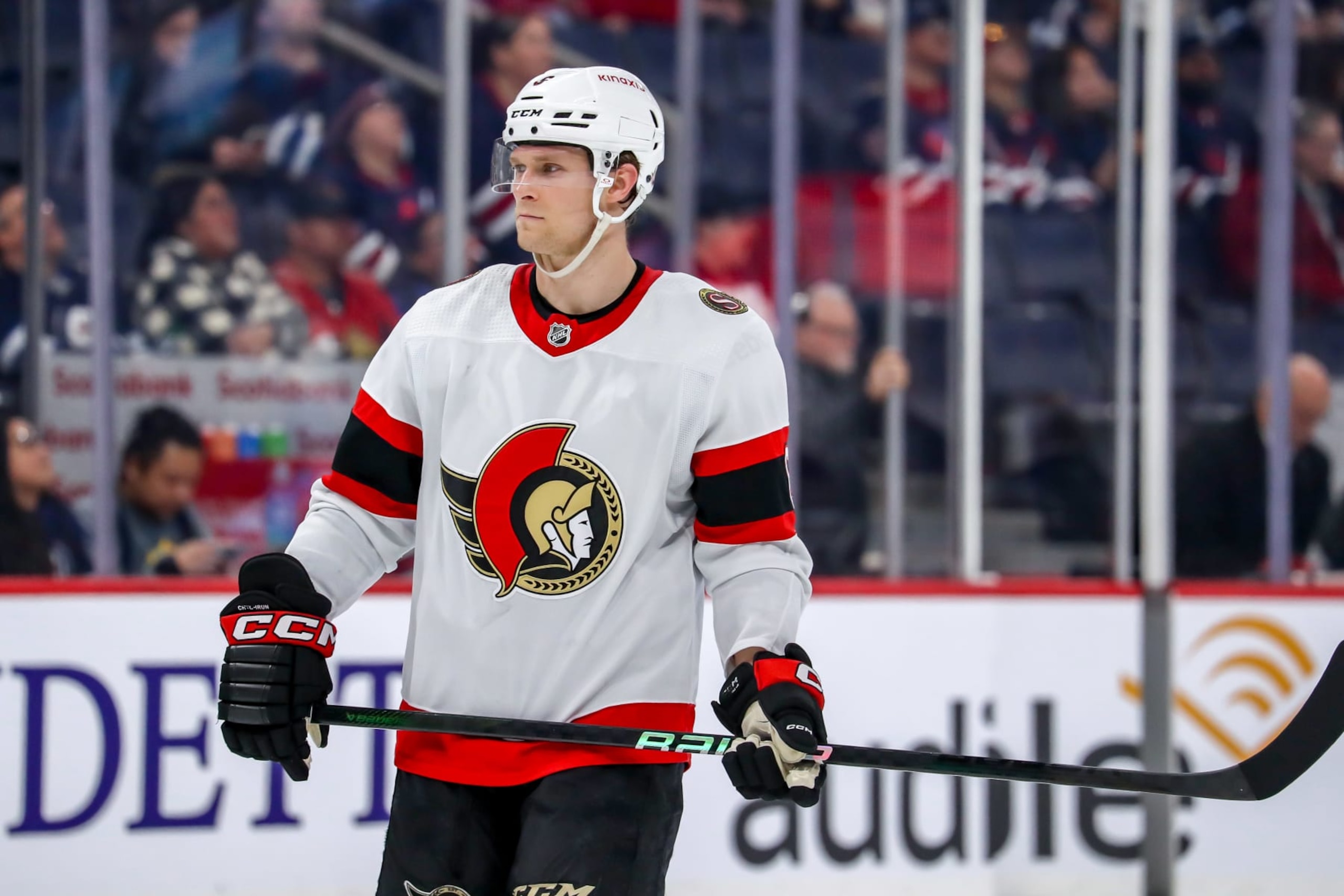 WINNIPEG, CANADA - MARCH 30: Jakob Chychrun #6 of the Ottawa Senators looks on during a second period stoppage in play against the Winnipeg Jets at the Canada Life Centre on March 30, 2024 in Winnipeg, Manitoba, Canada. The Senators defeated the Jets 3-2. (Photo by Darcy Finley/NHLI via Getty Images)