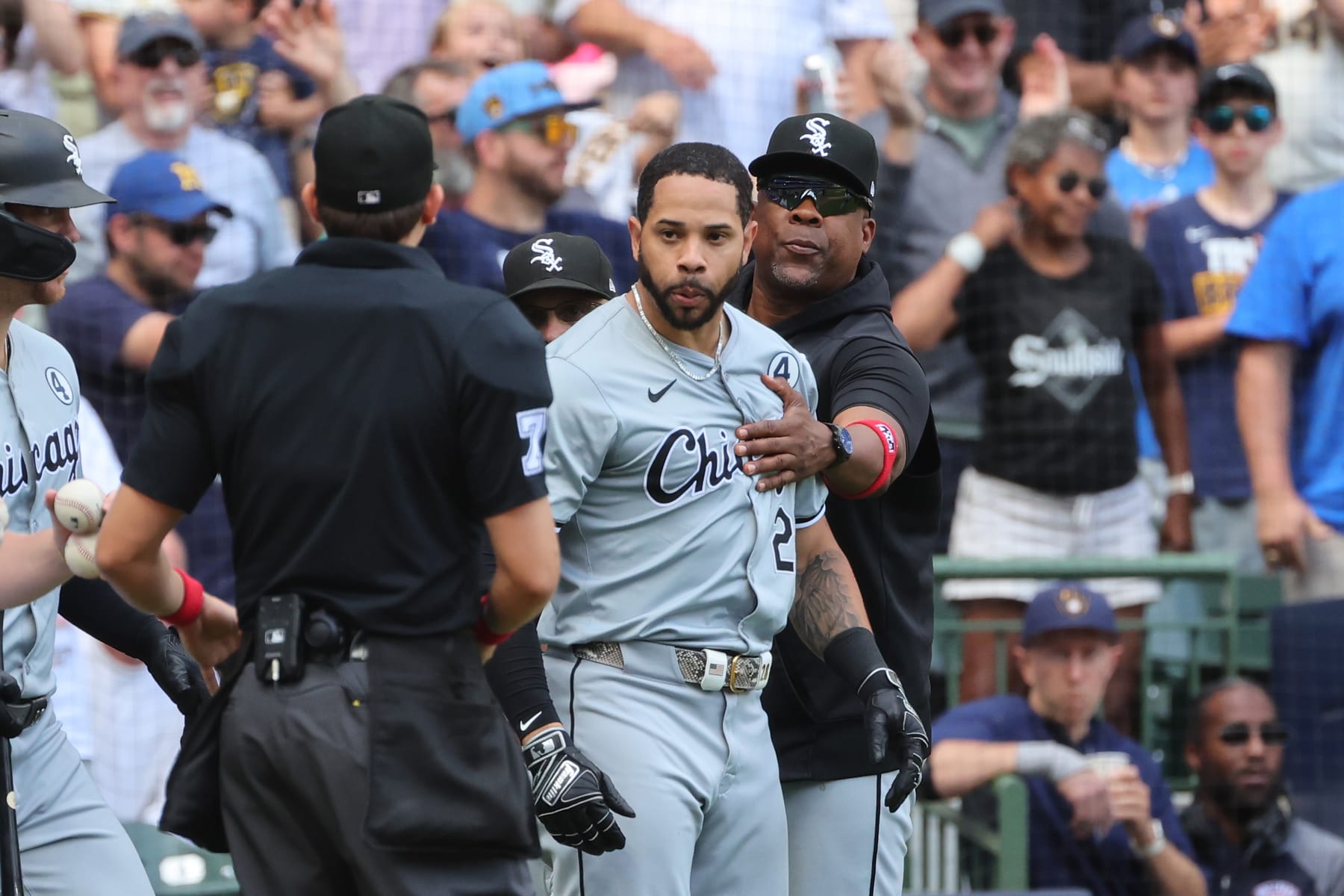MILWAUKEE, WISCONSIN - JUNE 02: Tommy Pham #28 of the Chicago White Sox is restrained by coaches during the eighth inning against the Milwaukee Brewers at American Family Field on June 02, 2024 in Milwaukee, Wisconsin. (Photo by Stacy Revere/Getty Images)