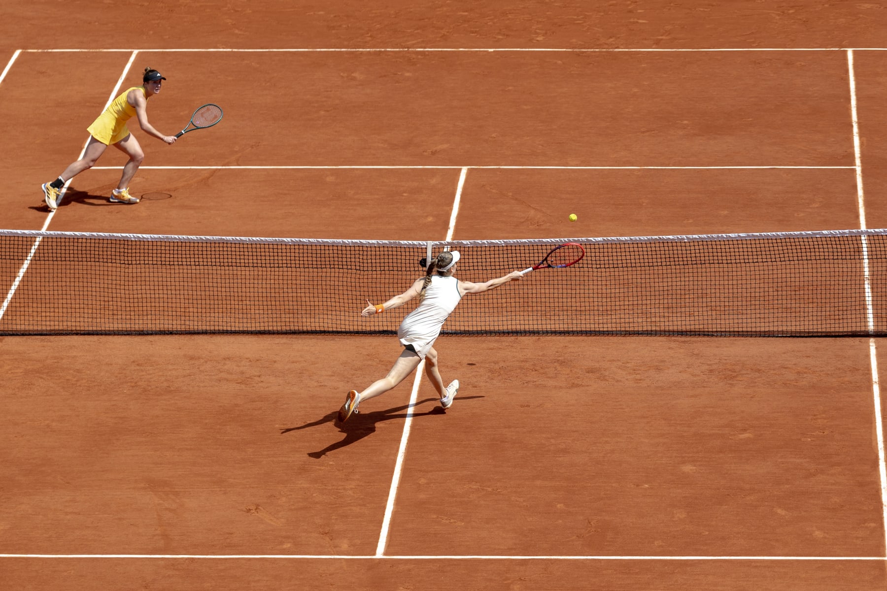 PARIS, FRANCE - June 03: Elena Rybakina of Kazakhstan plays a winner at the net during her victory against Elina Svitolina of Ukraine on Court Philippe-Chatrier during the fourth round of the 2024 French Open Tennis Tournament at Roland Garros on June 3rd, 2024, in Paris, France. (Photo by Tim Clayton/Corbis via Getty Images)