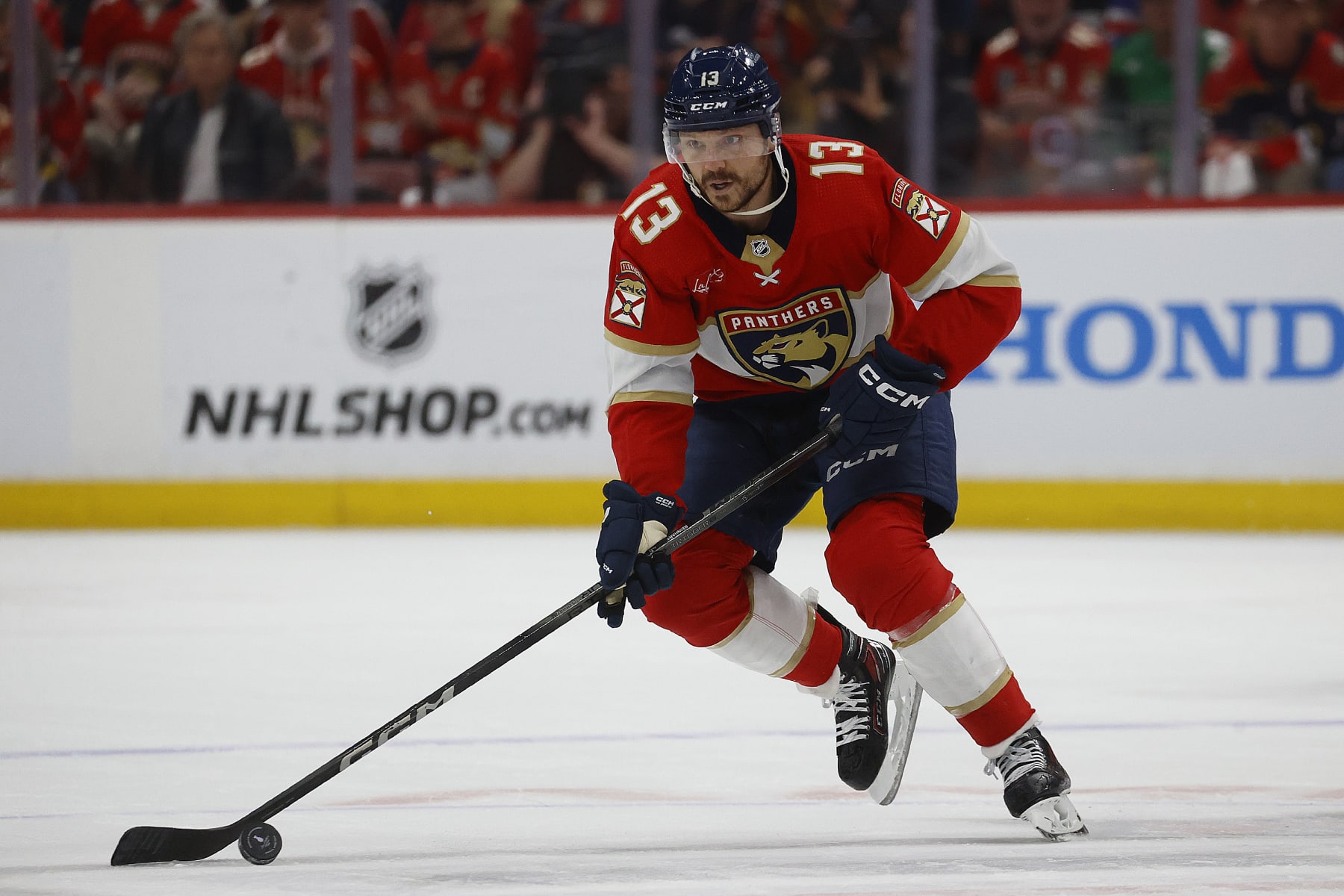 SUNRISE, FLORIDA - MAY 26: Sam Reinhart #13 of the Florida Panthers skates with the puck during the first period against the New York Rangers in Game Three of the Eastern Conference Final at the Amerant Bank Arena on May 26, 2024 in Sunrise, Florida. (Photo by Eliot J. Schechter/NHLI via Getty Images)