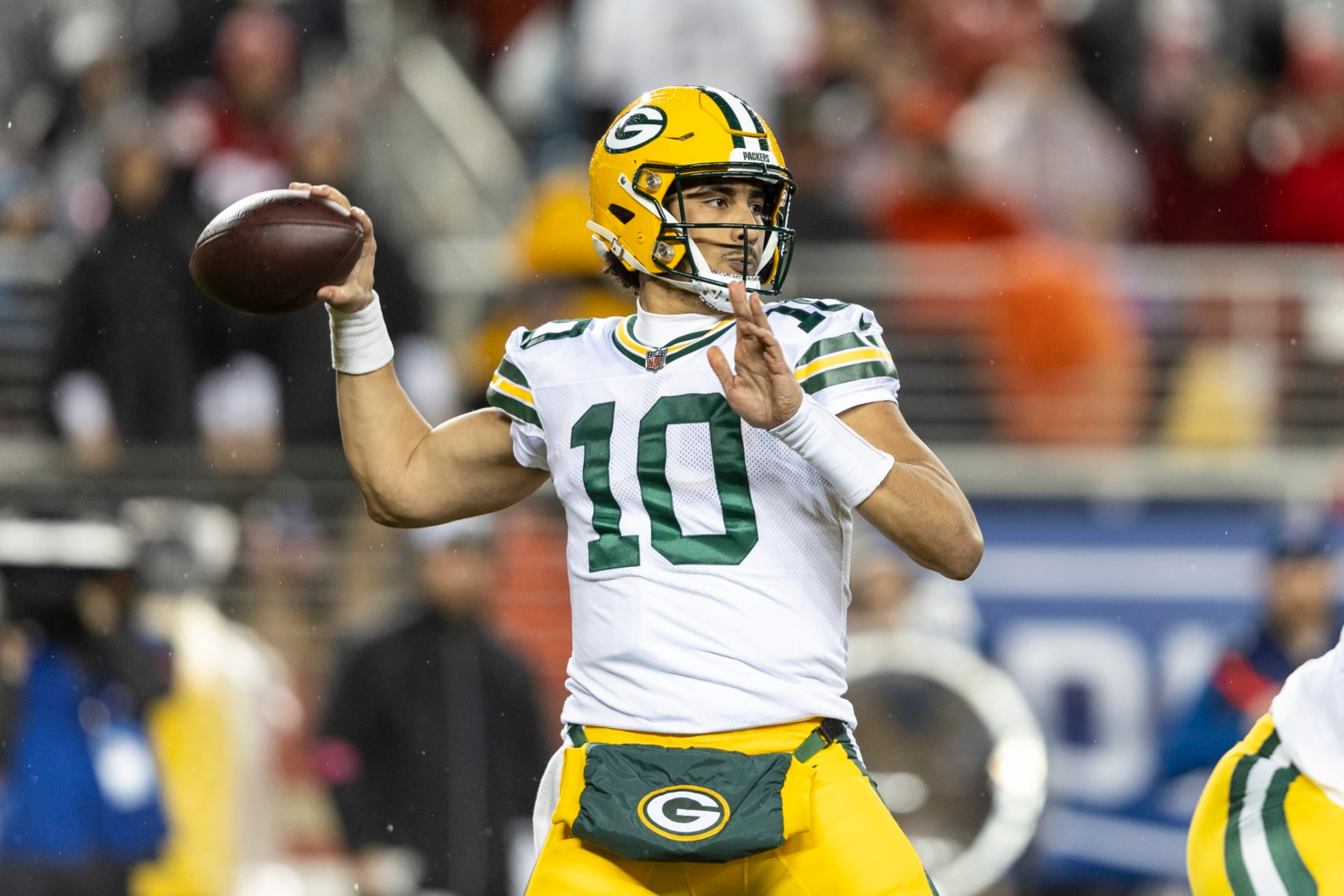 SANTA CLARA, CALIFORNIA - JANUARY 20: Jordan Love #10 of the Green Bay Packers looks to pass during an NFL divisional round playoff football game between the San Francisco 49ers and the Green Bay Packers at Levi's Stadium on January 20, 2024 in Santa Clara, California. (Photo by Michael Owens/Getty Images)