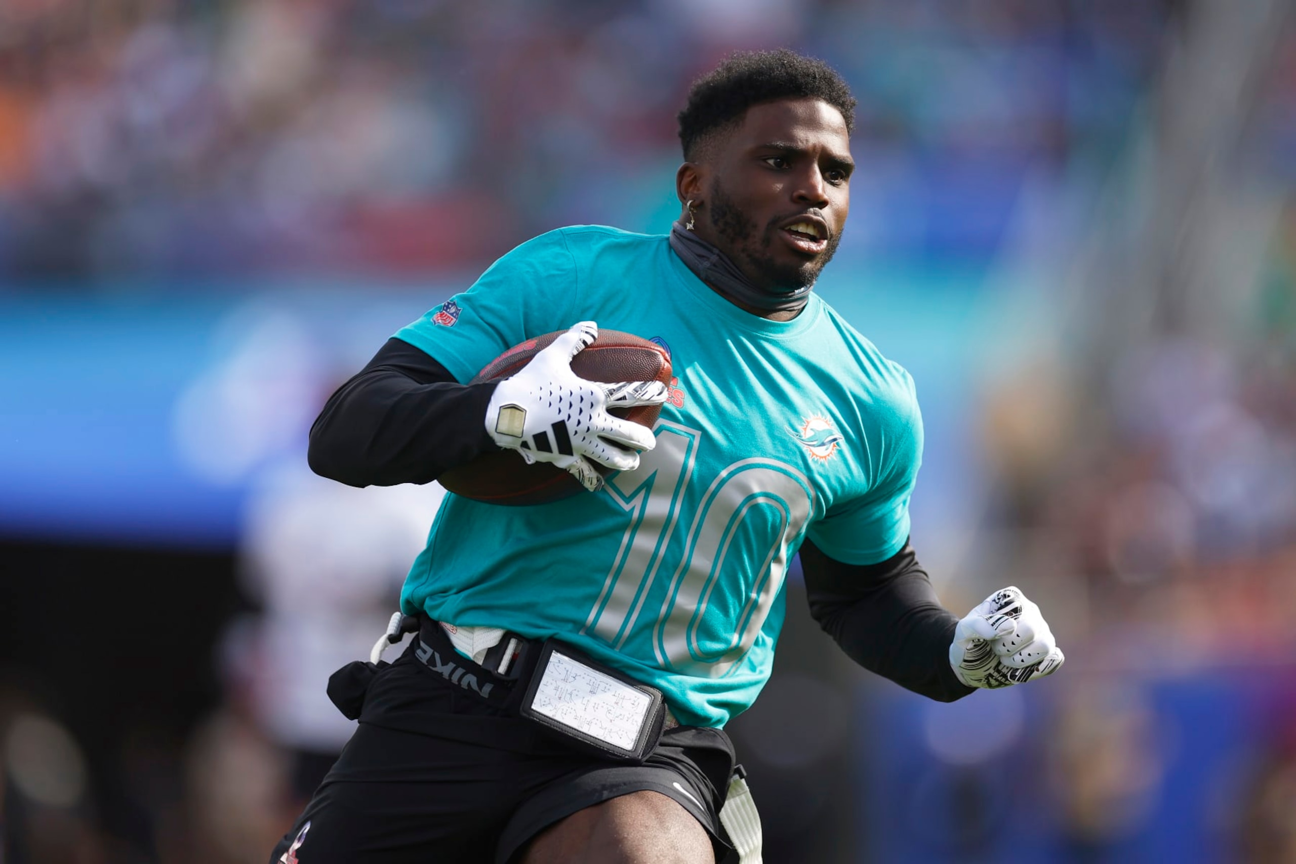 ORLANDO, FLORIDA - FEBRUARY 04: Tyreek Hill #10 of the Miami Dolphins and AFC runs with the ball during the first half of the 2024 NFL Pro Bowl Games at Camping World Stadium on February 04, 2024 in Orlando, Florida. (Photo by Mike Ehrmann/Getty Images) ORLANDO, FLORIDA - FEBRUARY 04: Tyreek Hill #10 of the Miami Dolphins and AFC runs with the ball during the first half of the 2024 NFL Pro Bowl Games at Camping World Stadium on February 04, 2024 in Orlando, Florida. (Photo by Mike Ehrmann/Getty Images)