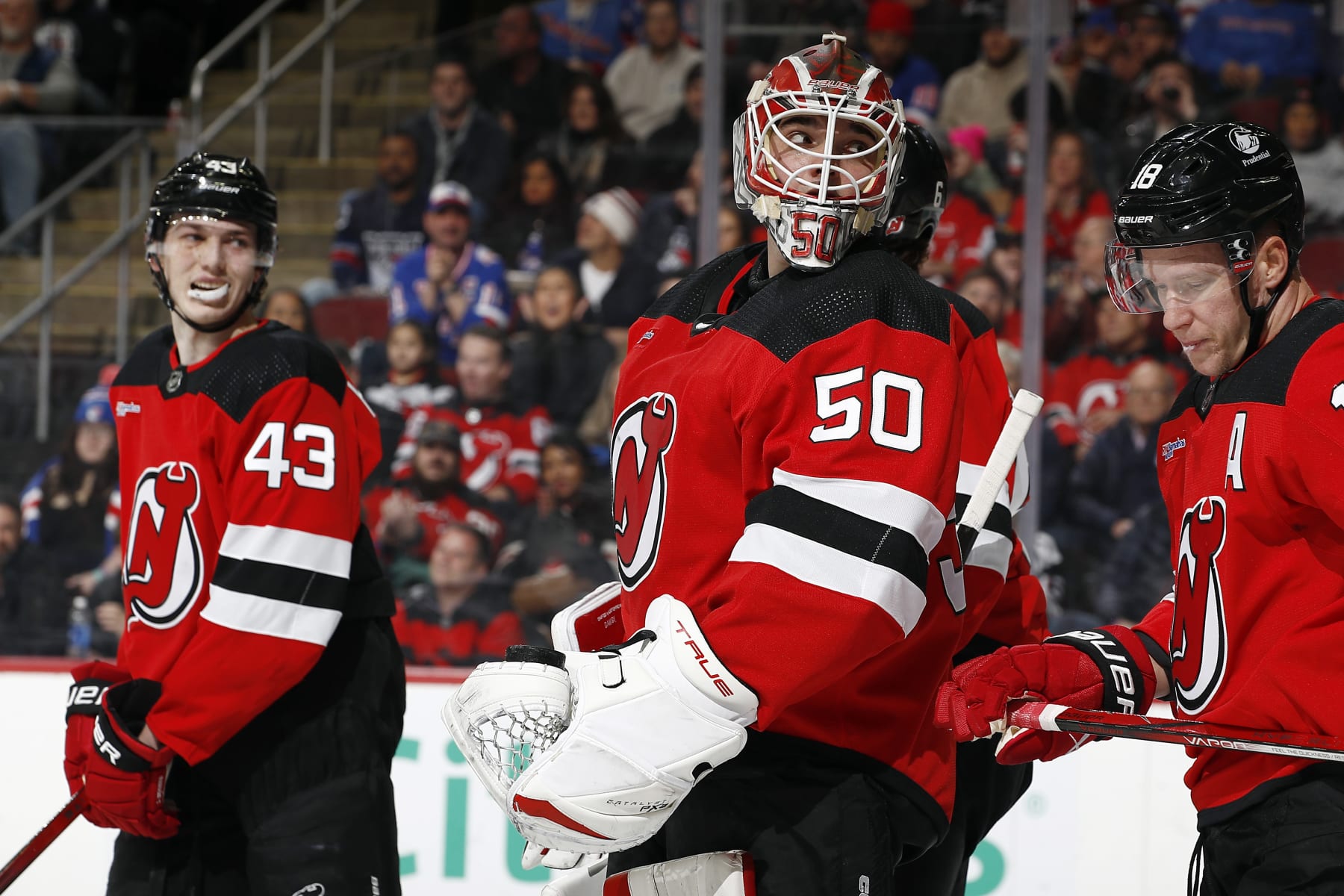 NEWARK, NEW JERSEY - FEBRUARY 22: Nico Daws #50 of the New Jersey Devils reacts after allowing a goal to Alexis Lafreniere #13 of the New York Rangers during the first period at Prudential Center on February 22, 2024 in Newark, New Jersey. (Photo by Sarah Stier/Getty Images)