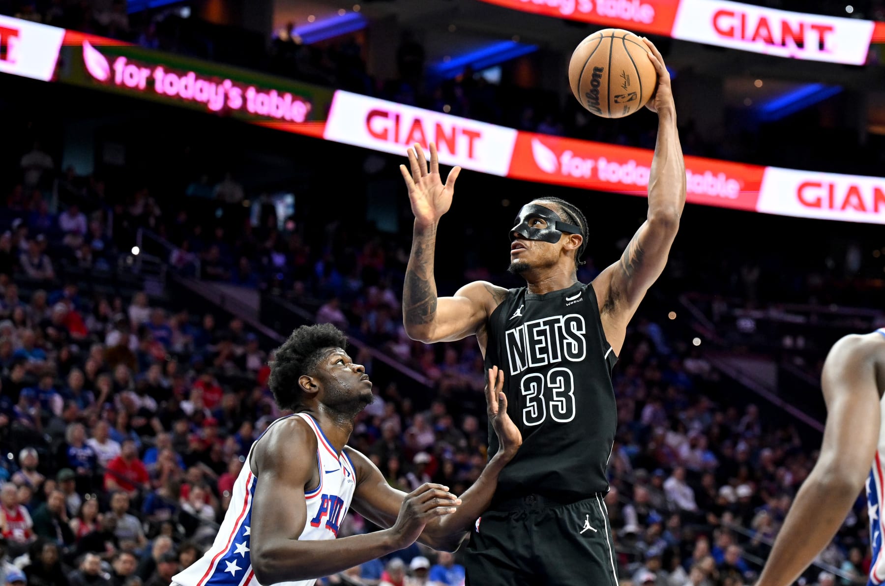 PHILADELPHIA, PENNSYLVANIA - APRIL 14: Nic Claxton #33 of the Brooklyn Nets shoots the ball against Mo Bamba #5 of the Philadelphia 76ers at the Wells Fargo Center on April 14, 2024 in Philadelphia, Pennsylvania. NOTE TO USER: User expressly acknowledges and agrees that, by downloading and or using this photograph, User is consenting to the terms and conditions of the Getty Images License Agreement. (Photo by G Fiume/Getty Images)