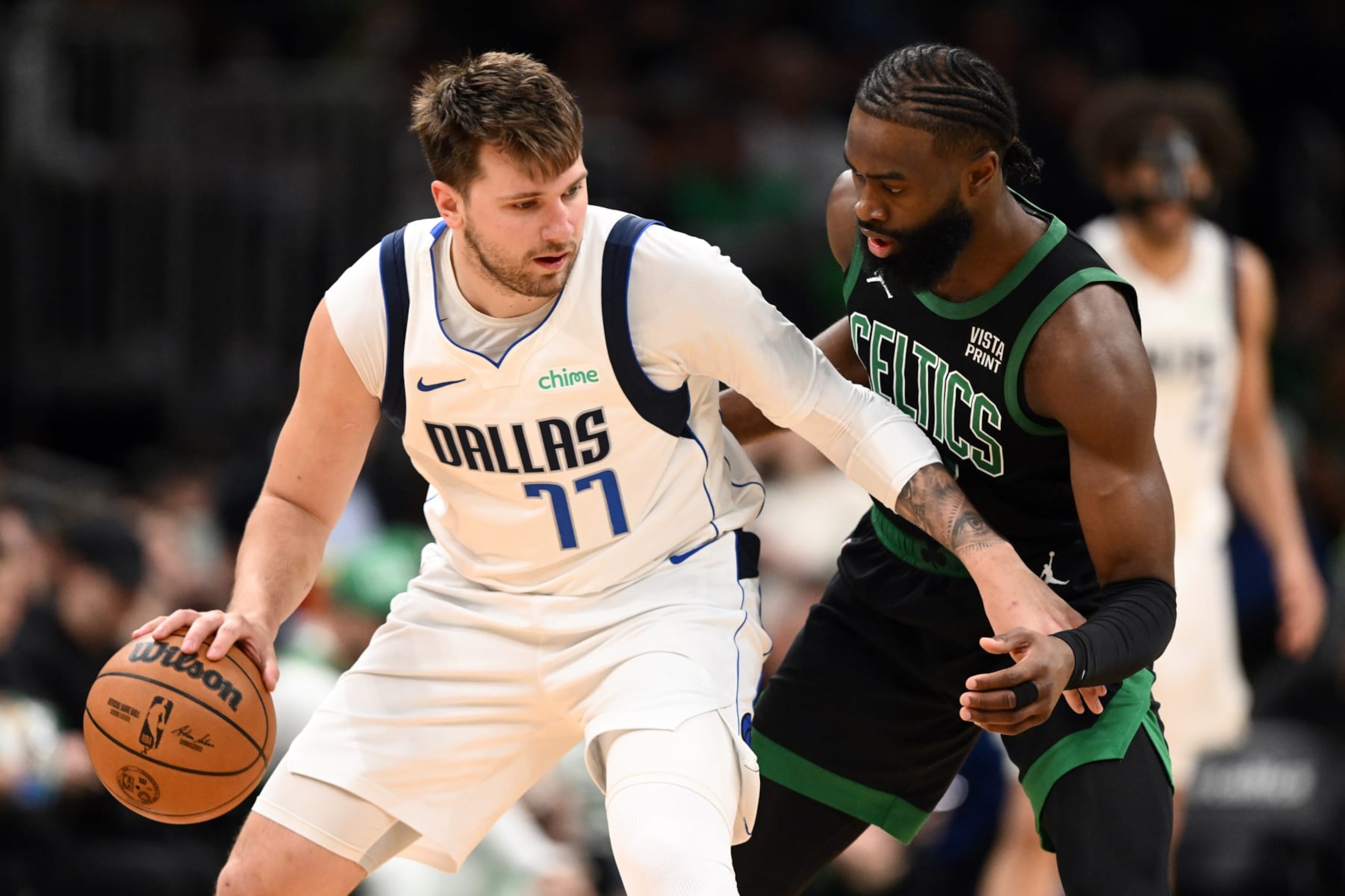 BOSTON, MASSACHUSETTS - MARCH 01: Jaylen Brown #7 of the Boston Celtics defends Luka Doncic #77 of the Dallas Mavericks during the third quarter at the TD Garden on March 01, 2024 in Boston, Massachusetts. NOTE TO USER: User expressly acknowledges and agrees that, by downloading and or using this photograph, User is consenting to the terms and conditions of the Getty Images License Agreement. (Photo by Brian Fluharty/Getty Images)