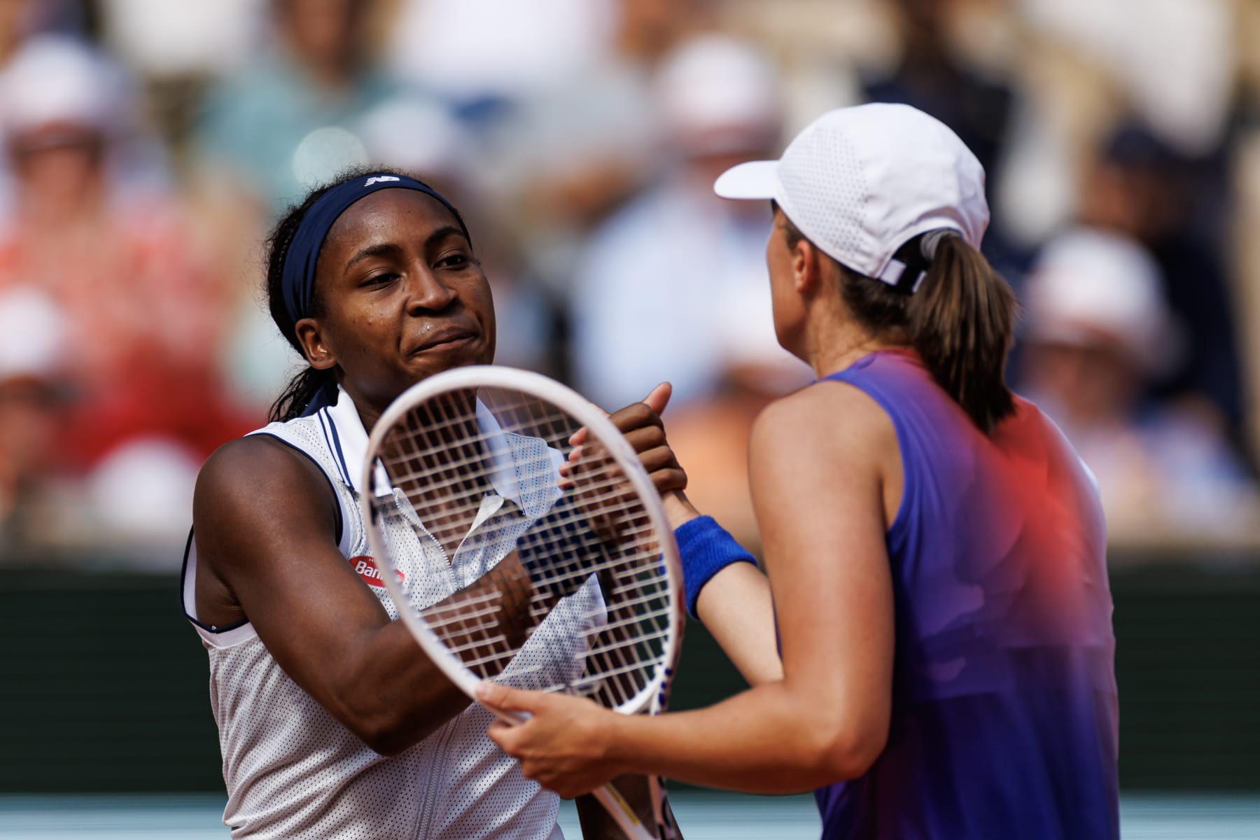 PARIS, FRANCE - JUNE 06: iga Swiatek of Poland shakes hands with Coco Gauff of the United States in the semi-final of the women's singles at Roland Garros on June 06, 2024 in Paris, France. (Photo by Frey/TPN/Getty Images)