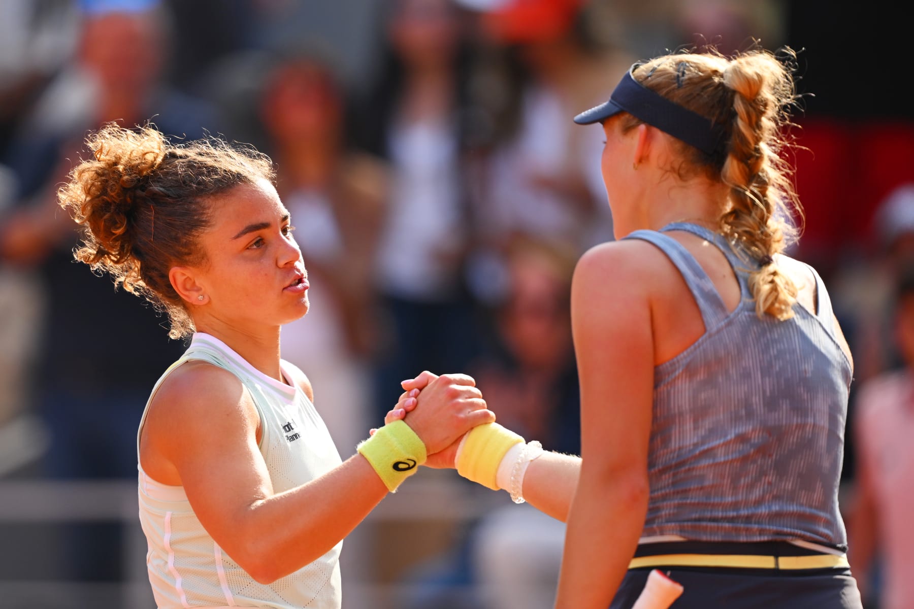 PARIS, FRANCE - JUNE 06: Jasmine Paolini of Italy shakes hands with Mirra Andreeva after the Women's Singles Semi-Final match on Day 12 at Roland Garros on June 06, 2024 in Paris, France. (Photo by Tim Goode/Getty Images)
