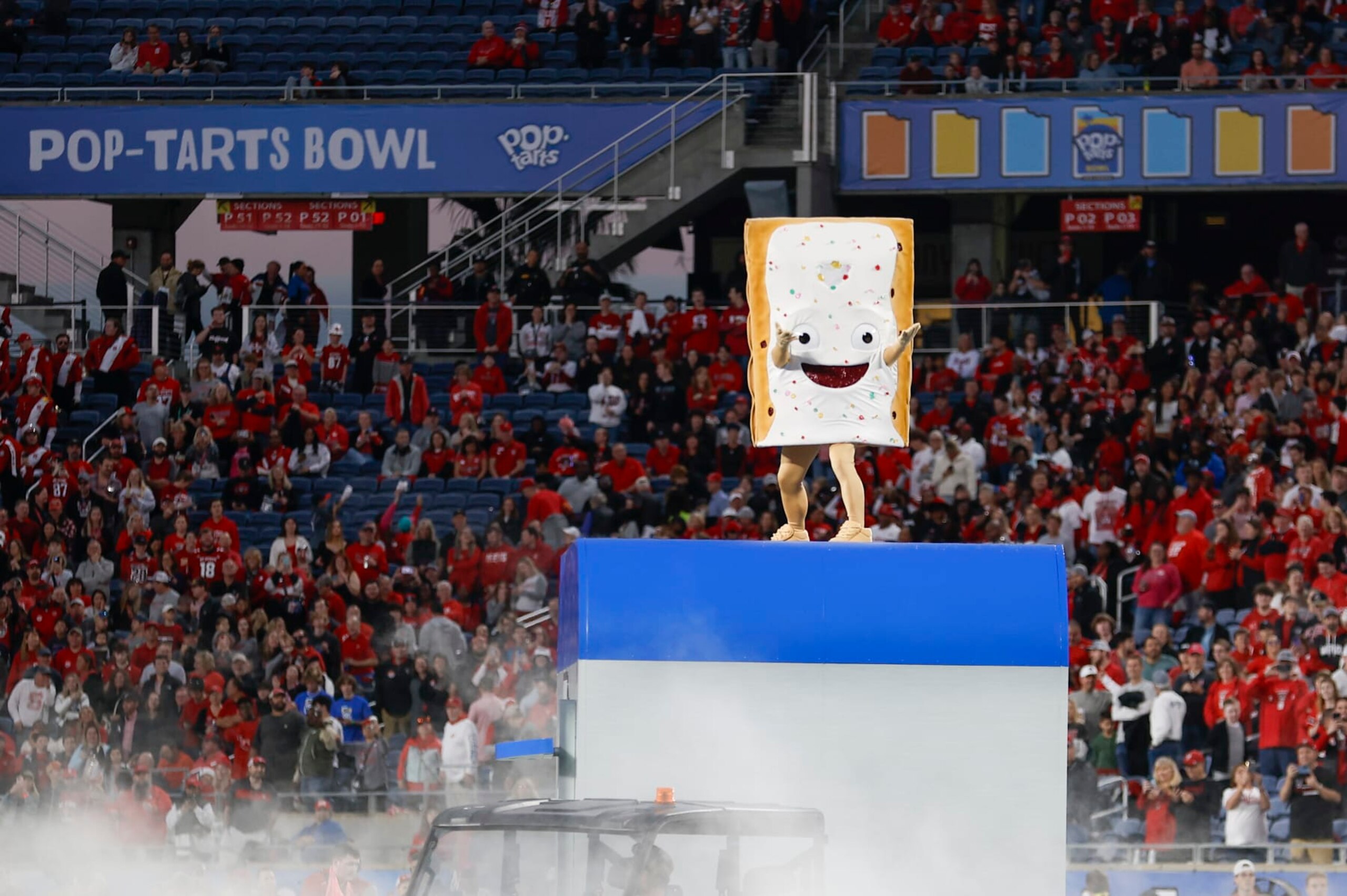 ORLANDO, FL - DECEMBER 28: The Pop-Tart Bowl mascot, Strawberry, after the game between the North Carolina State Wolfpack and the Kansas State Wildcats on December 28, 2023 at Camping World Stadium in Orlando, Fl. (Photo by David Rosenblum/Icon Sportswire via Getty Images)
