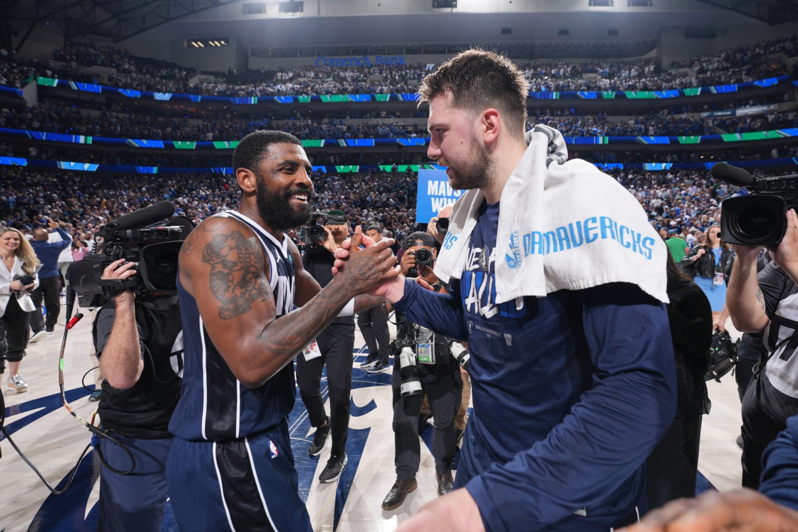 DALLAS, TX - MAY 26: Kyrie Irving #11 and Luka Doncic #77 of the Dallas Mavericks high five during the game against the Minnesota Timberwolves during Game 3 of the Western Conference Finals of the 2024 NBA Playoffs on May 26, 2024 at the American Airlines Center in Dallas, Texas. NOTE TO USER: User expressly acknowledges and agrees that, by downloading and or using this photograph, User is consenting to the terms and conditions of the Getty Images License Agreement. Mandatory Copyright Notice: Copyright 2024 NBAE (Photo by Jesse D. Garrabrant/NBAE via Getty Images)