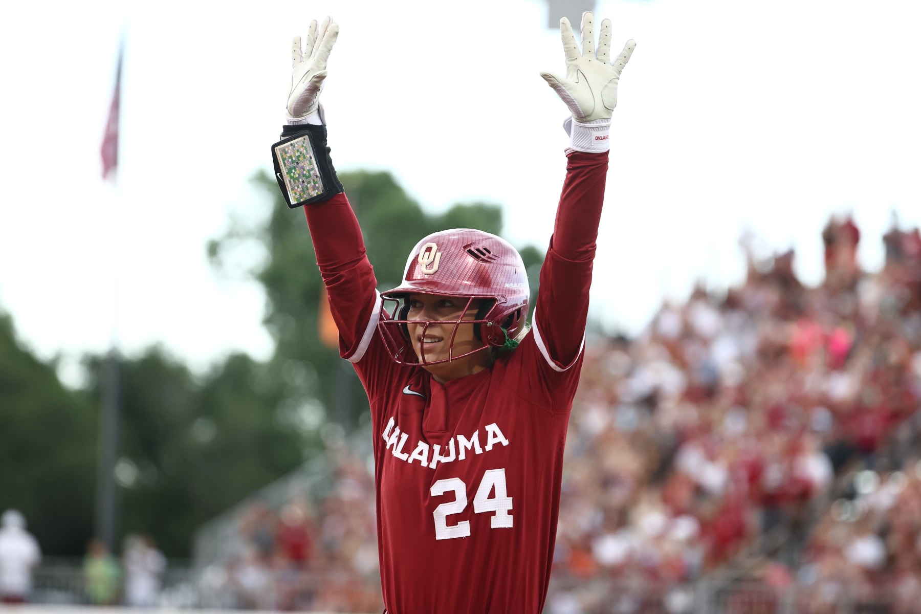 OKLAHOMA CITY, OKLAHOMA - JUNE 06: Jayda Coleman #24 of the Oklahoma Sooners reacts after getting on base during game two of the Division I Softball Championship held at Devon Park on June 6, 2024 in Oklahoma City, Oklahoma. (Photo by Tyler Schank/NCAA Photos via Getty Images)